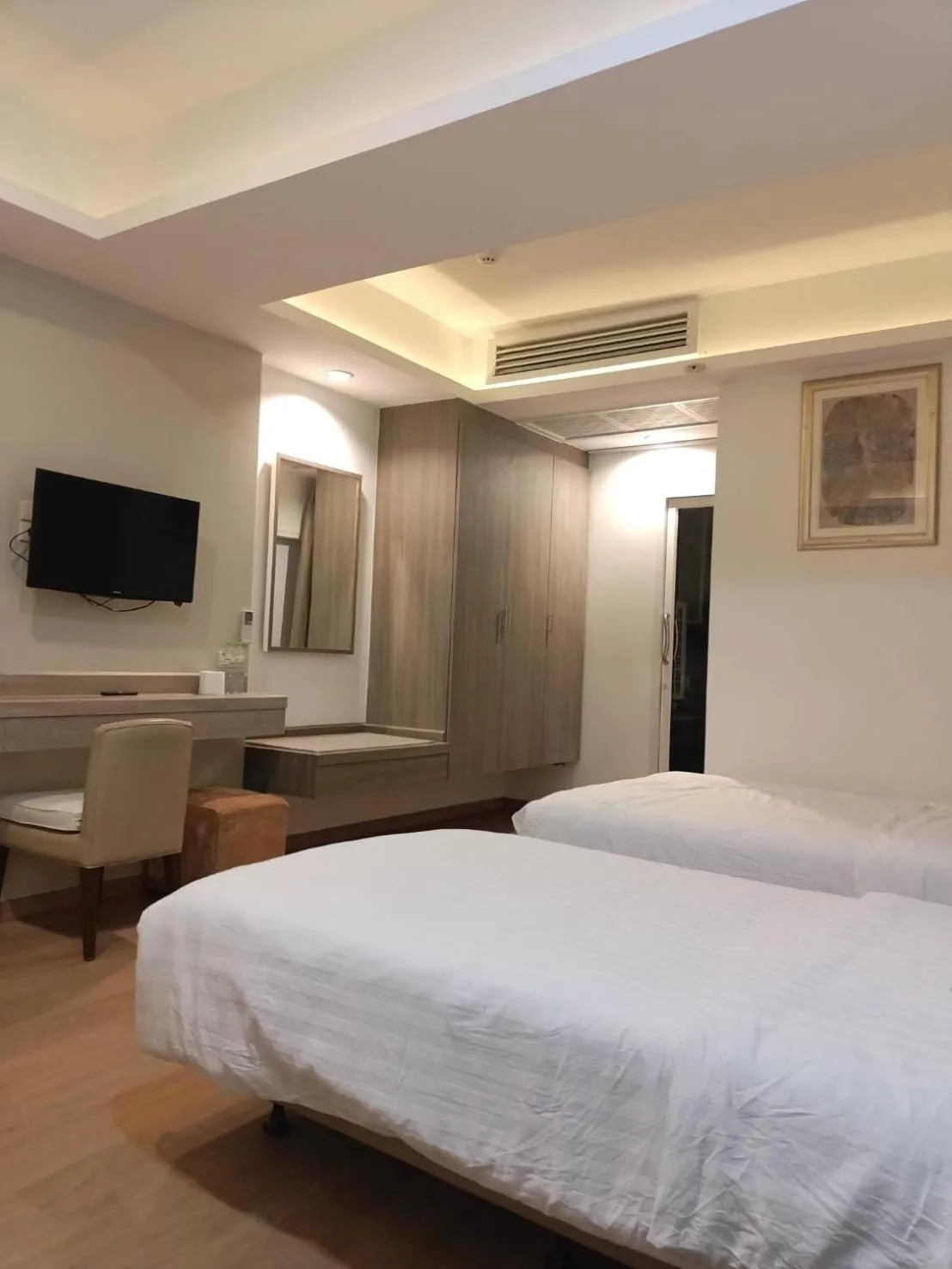 Bed in Royal Garden Home Hotel