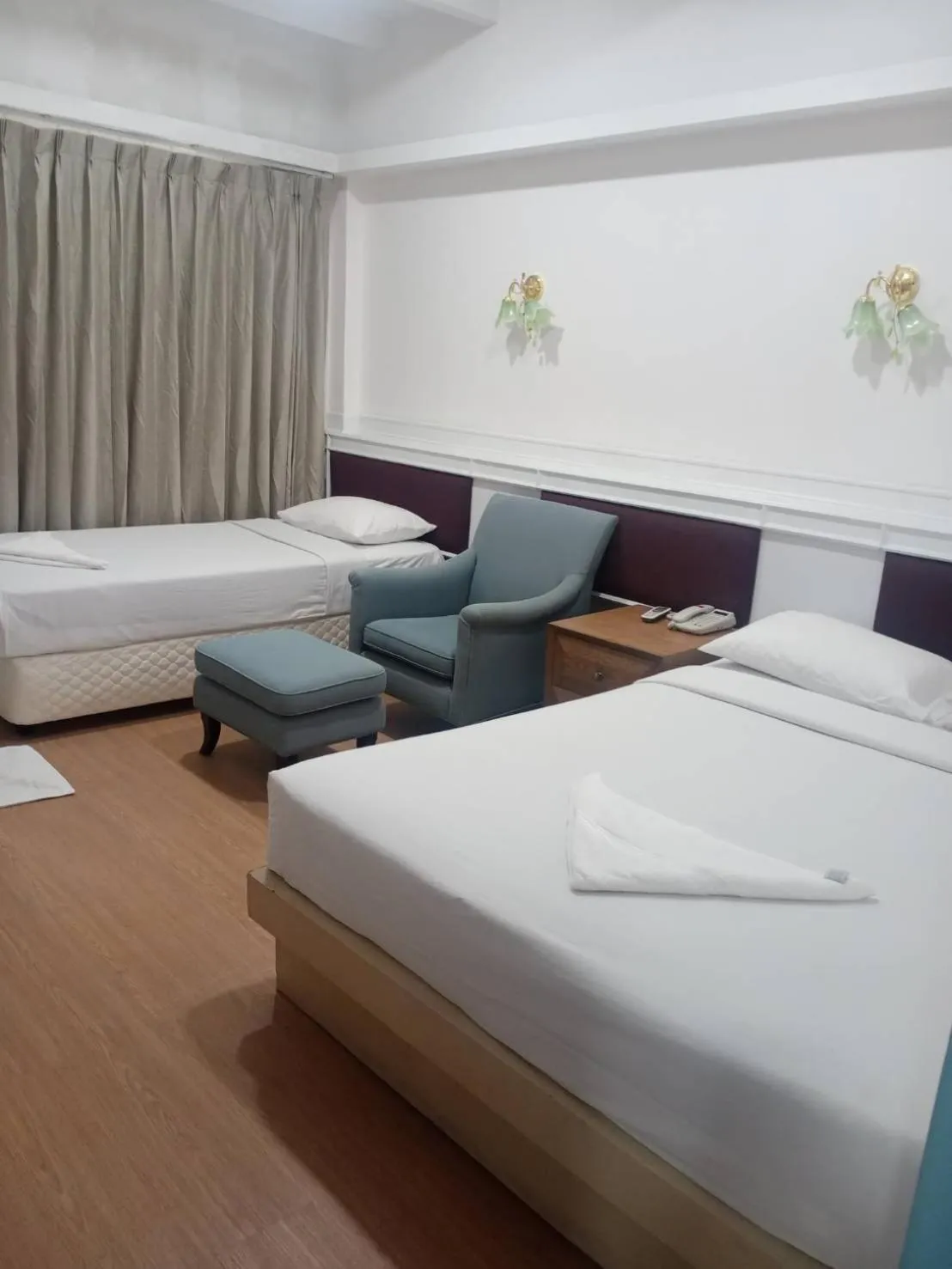 Bed in Royal Garden Home Hotel