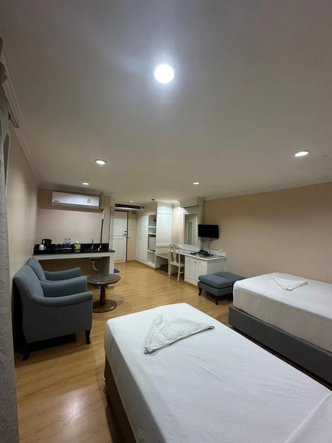 Bed in Royal Garden Home Hotel