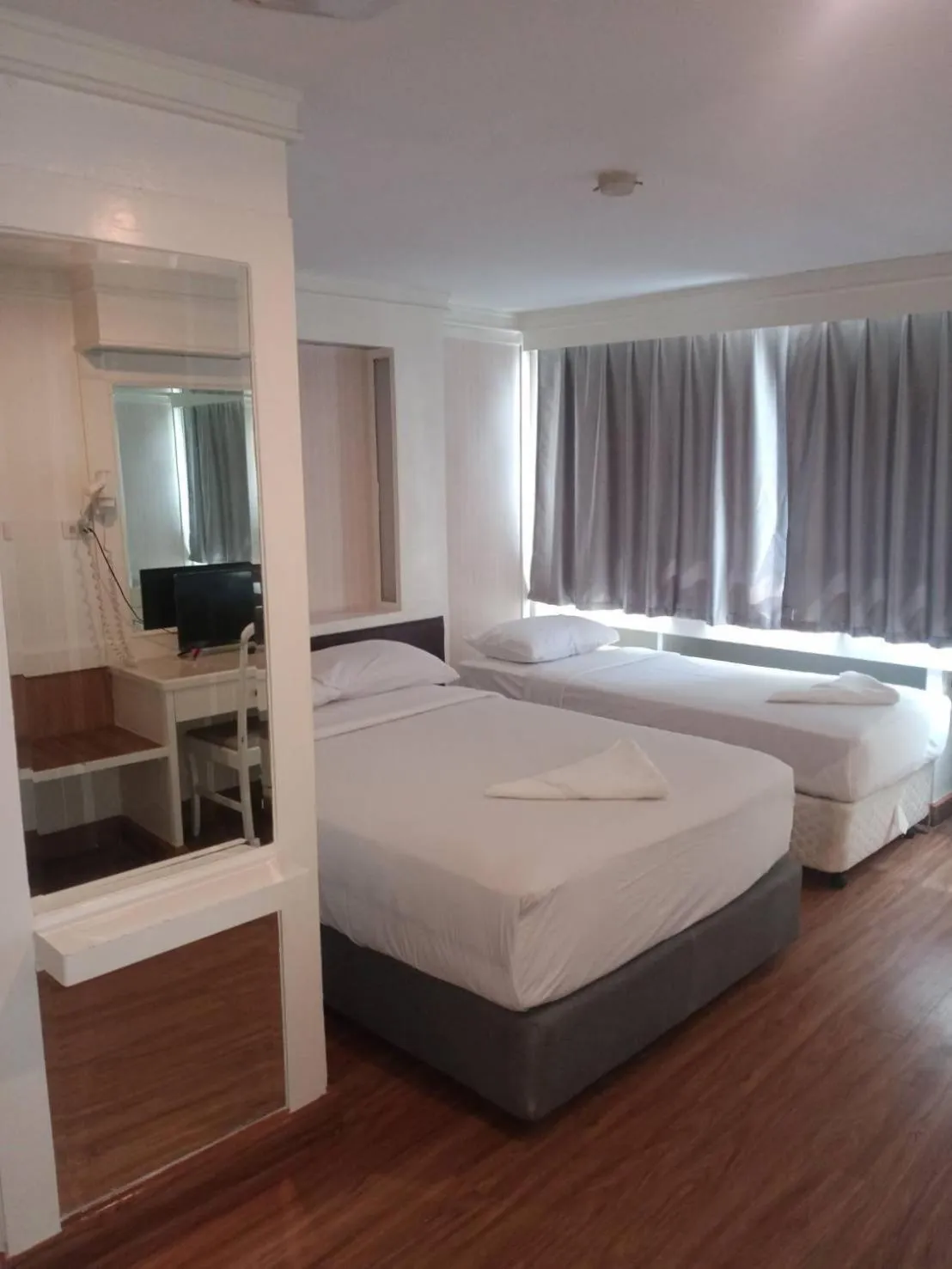 Bed in Royal Garden Home Hotel