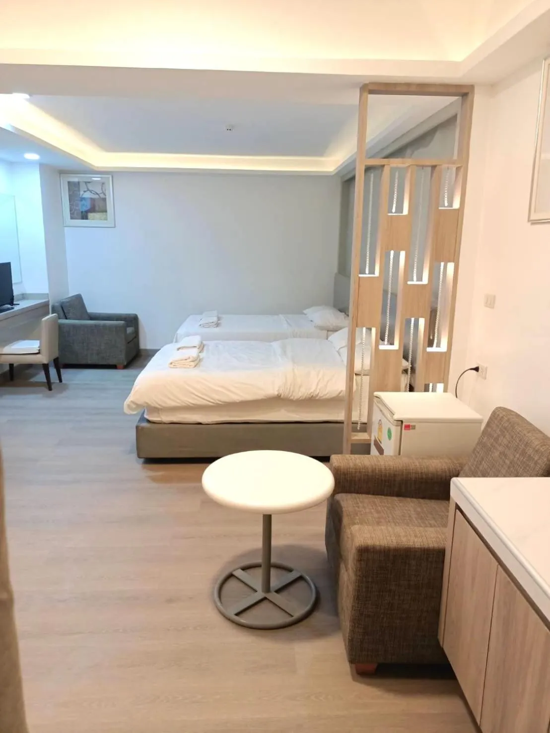 Bed in Royal Garden Home Hotel