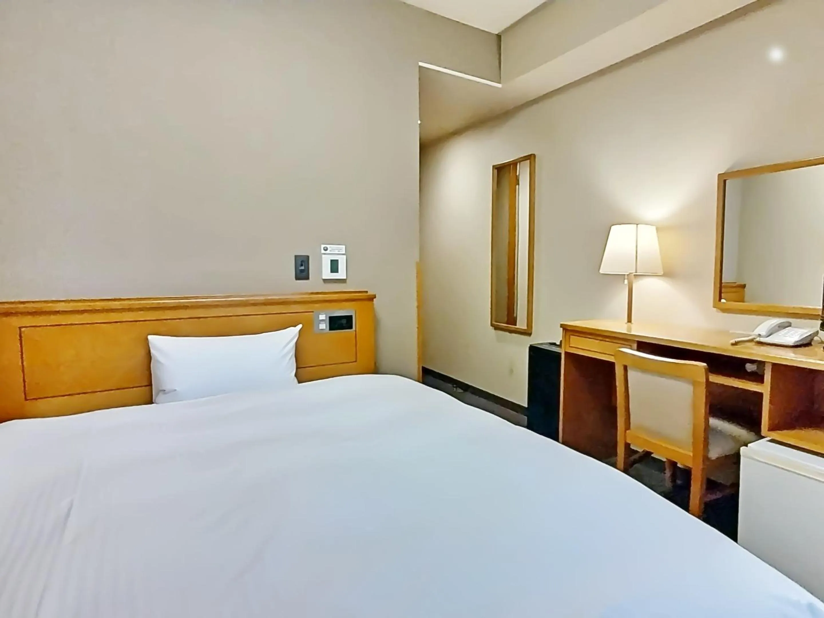 Photo of the whole room, Bed in Hotel Route-Inn Aomori Ekimae