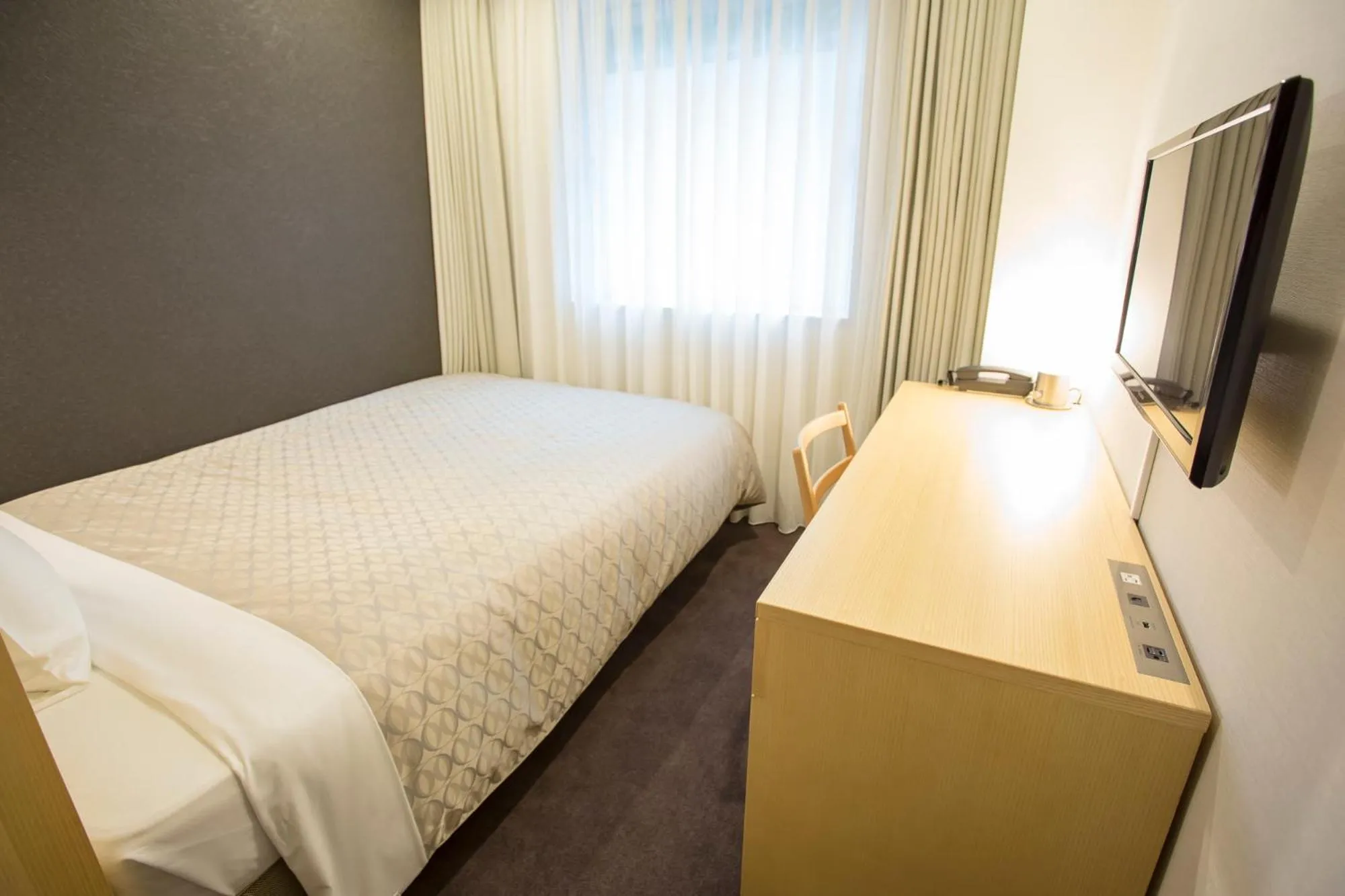 Bed in Hotel Asia Center of Japan