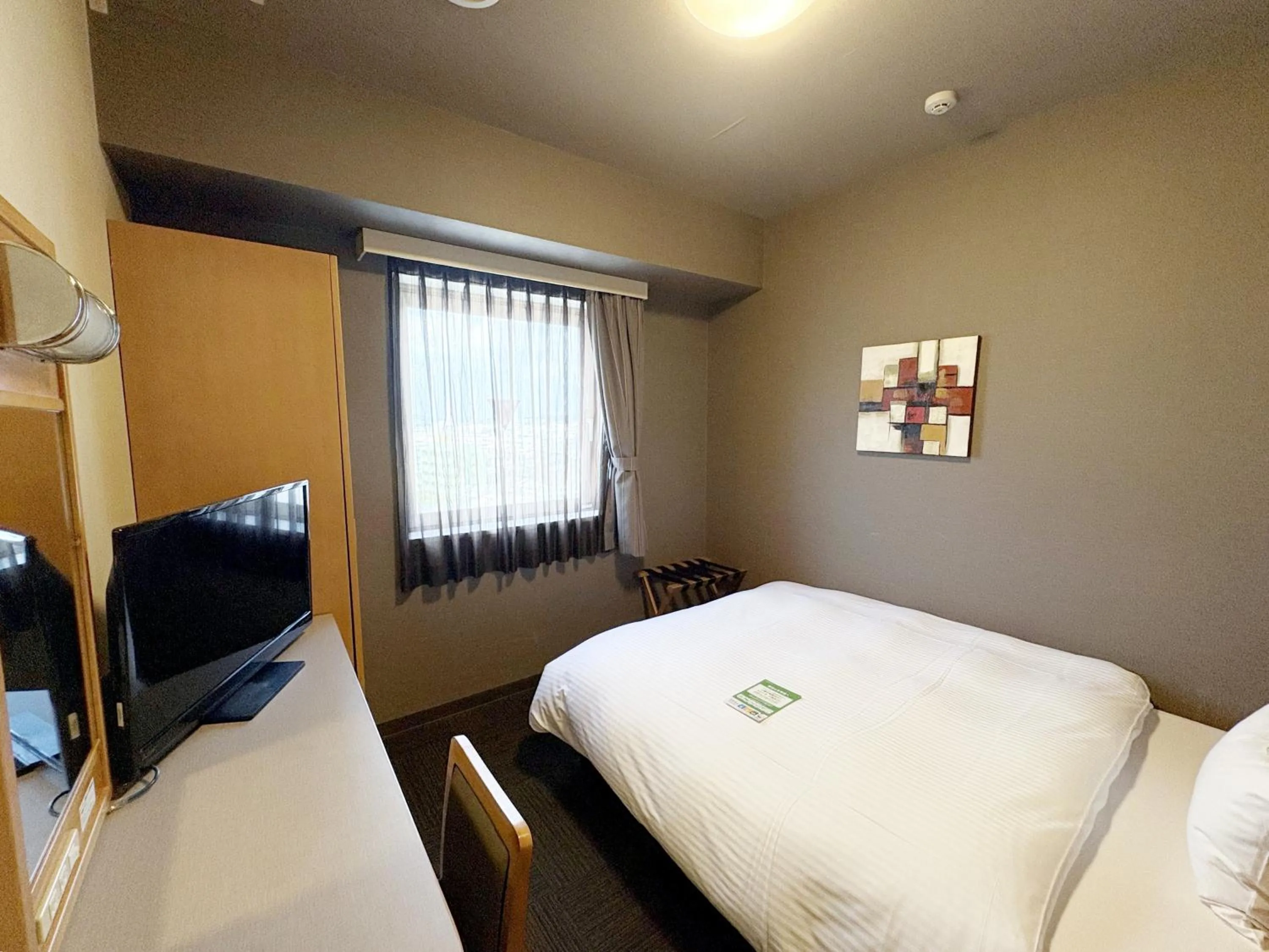 Photo of the whole room, Bed in Hotel Route-Inn Nago