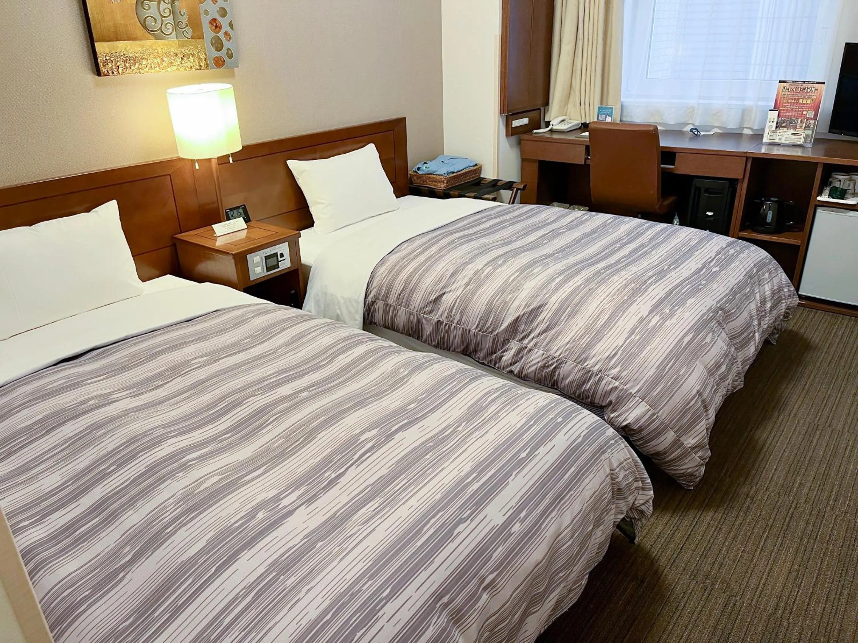Photo of the whole room, Bed in Hotel Route-Inn Sapporo Ekimae Kitaguchi