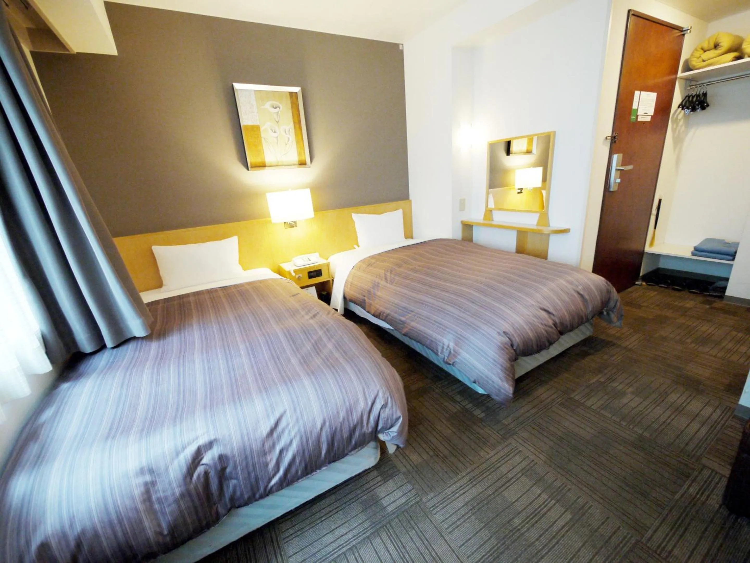 Photo of the whole room, Bed in Hotel Route-Inn Sapporo Ekimae Kitaguchi