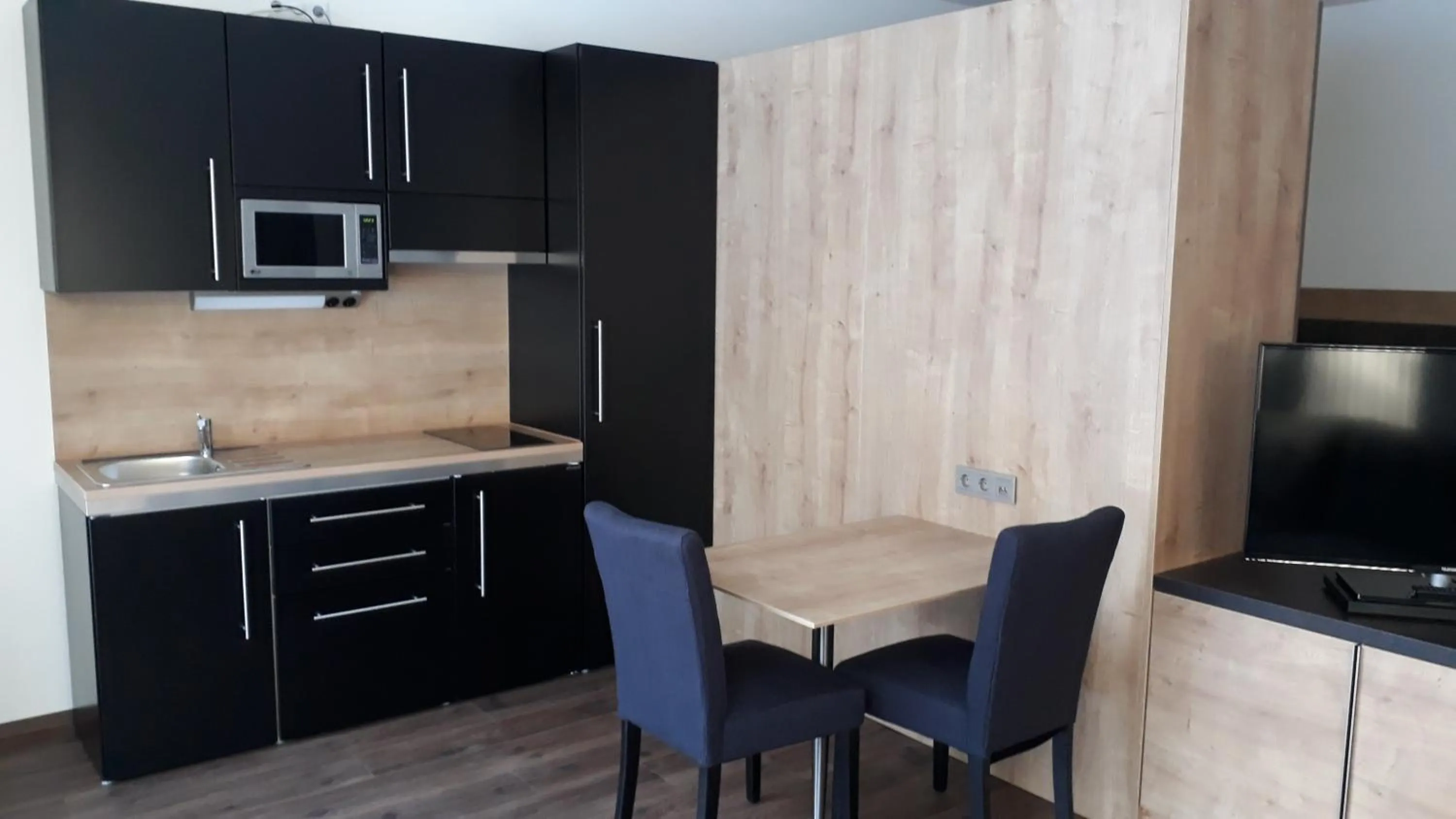 Kitchen or kitchenette in Waldhotel Rainau