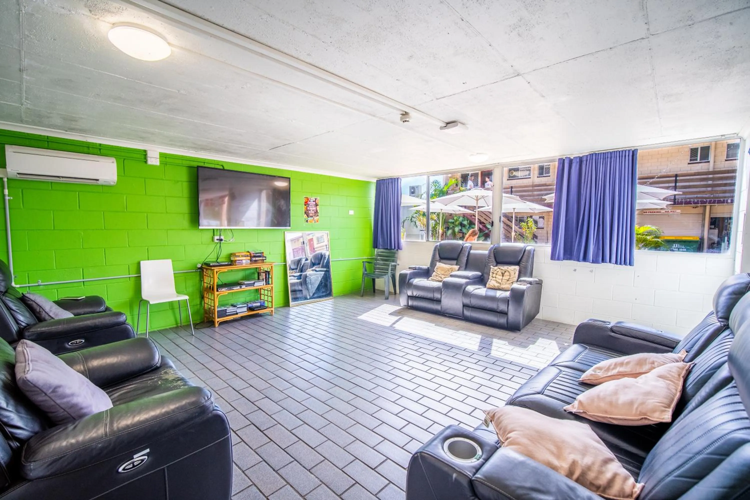 Communal lounge/ TV room in The Hostel, Airlie Beach