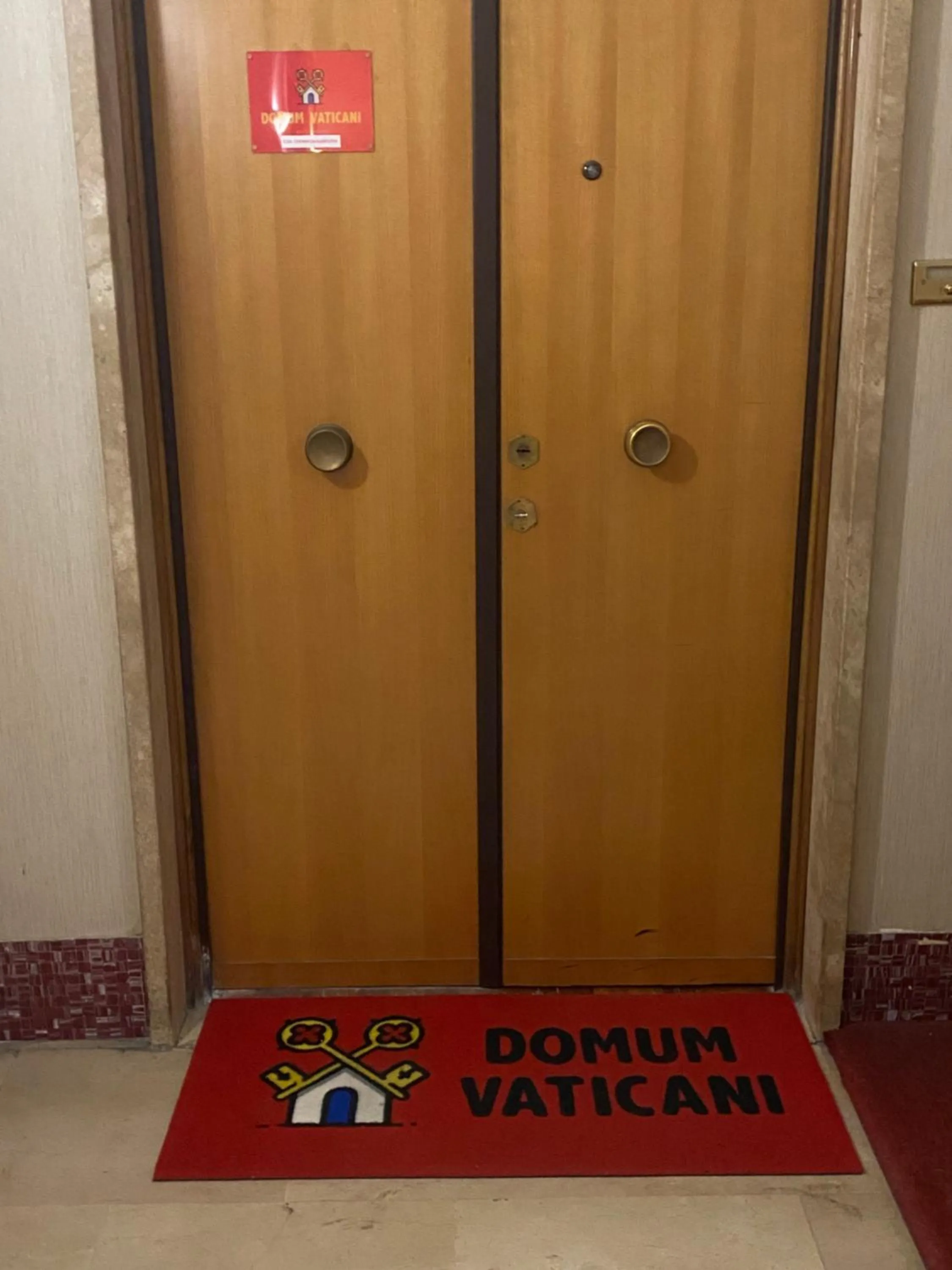 Property logo or sign in Domum Vaticani