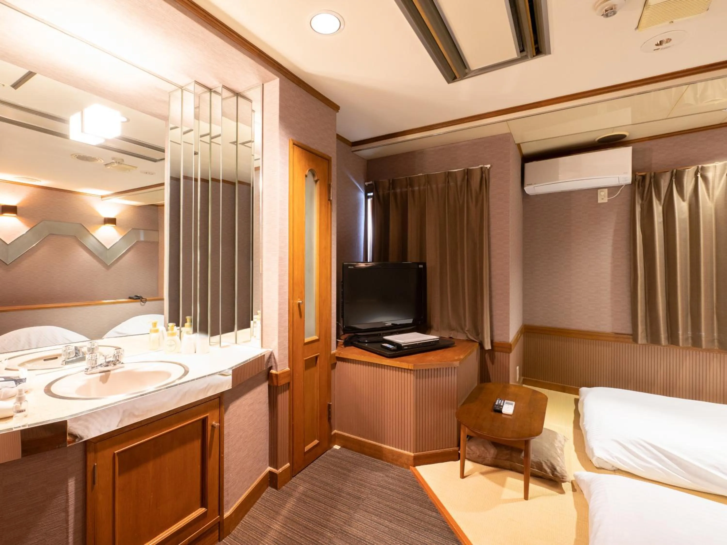 Bed in Tabist Hotel Rakuserina