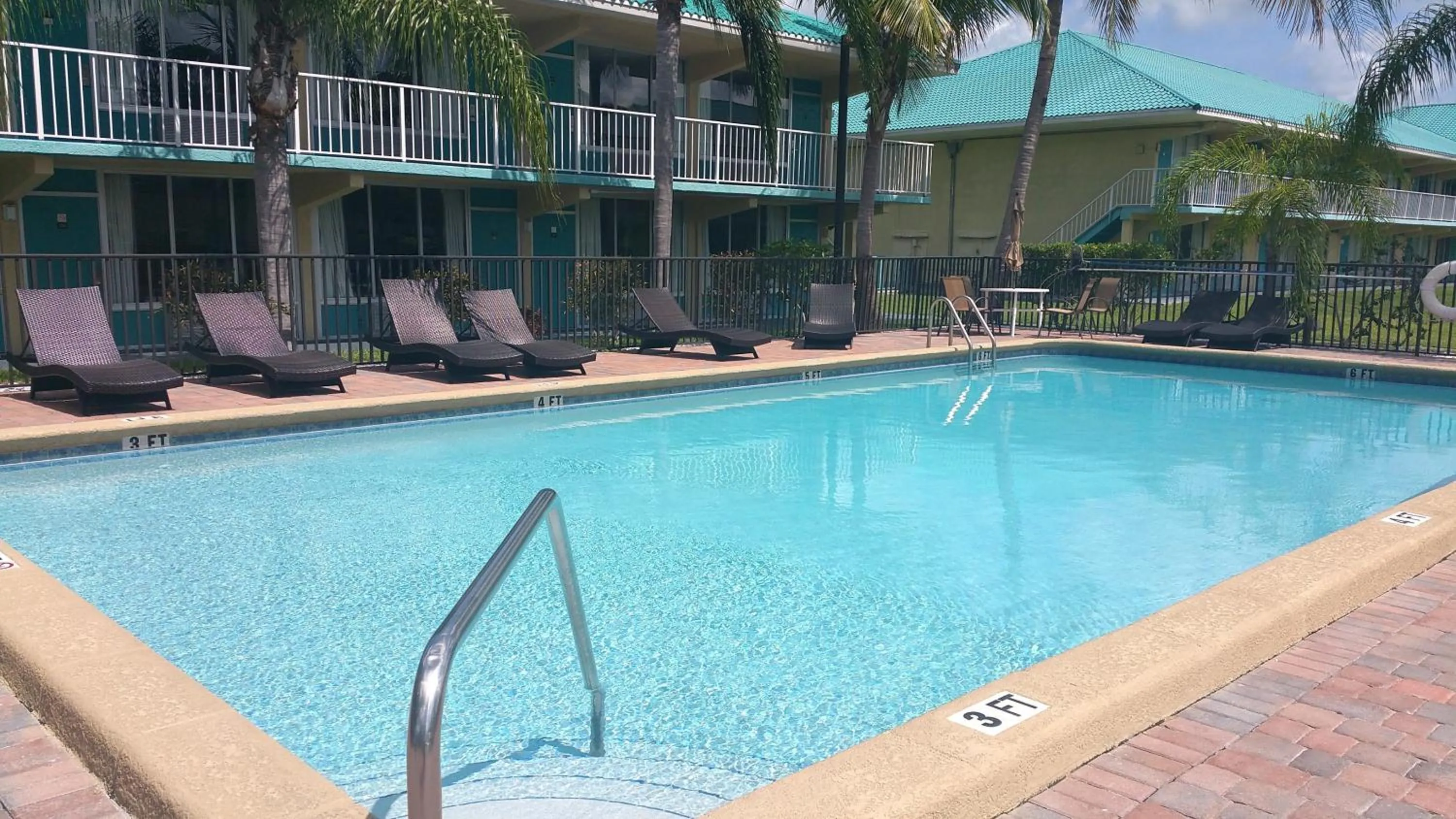 Swimming pool in Days Inn & Suites by Wyndham Fort Pierce Midtown