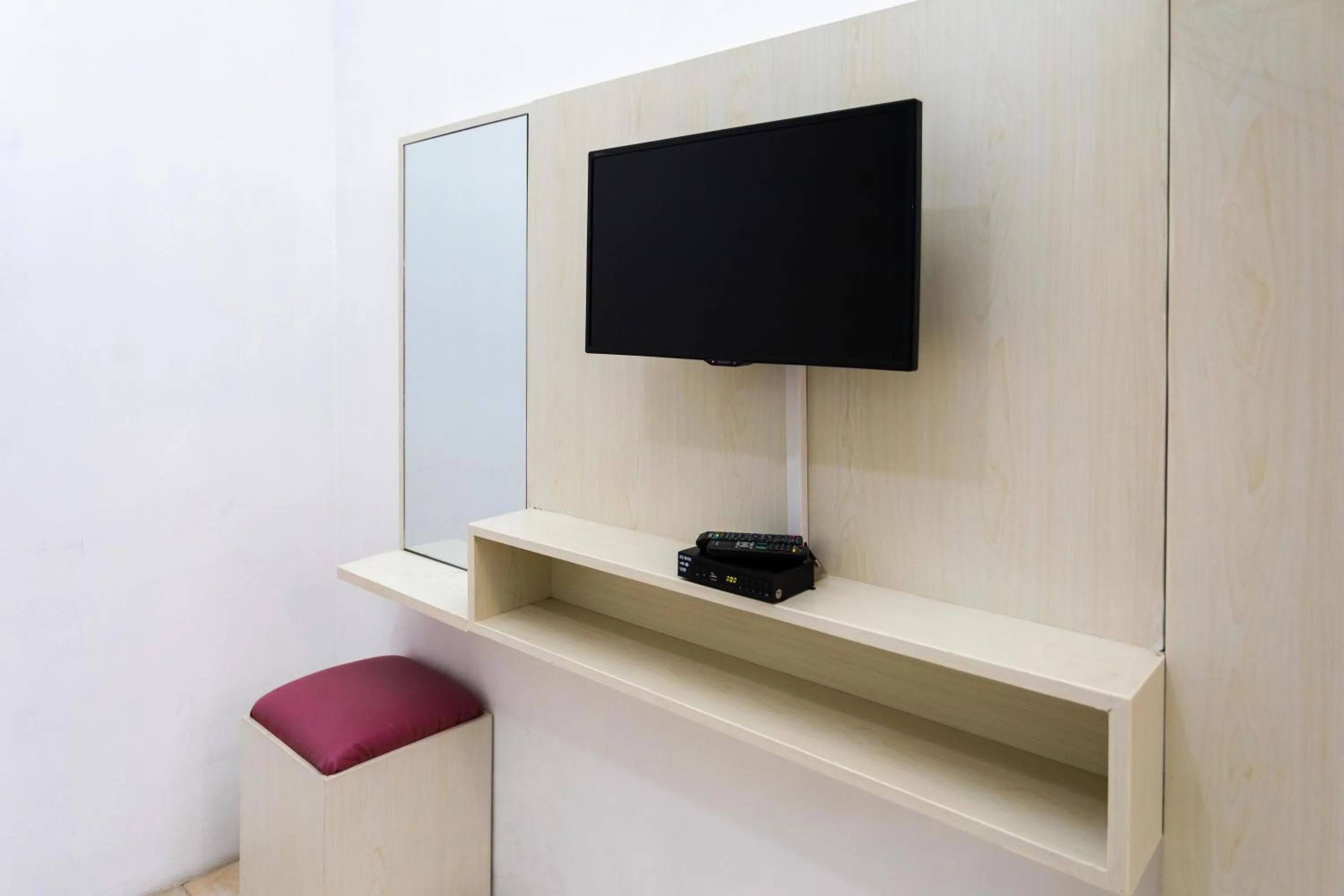 Communal lounge/ TV room in Batuque Town Villa 2