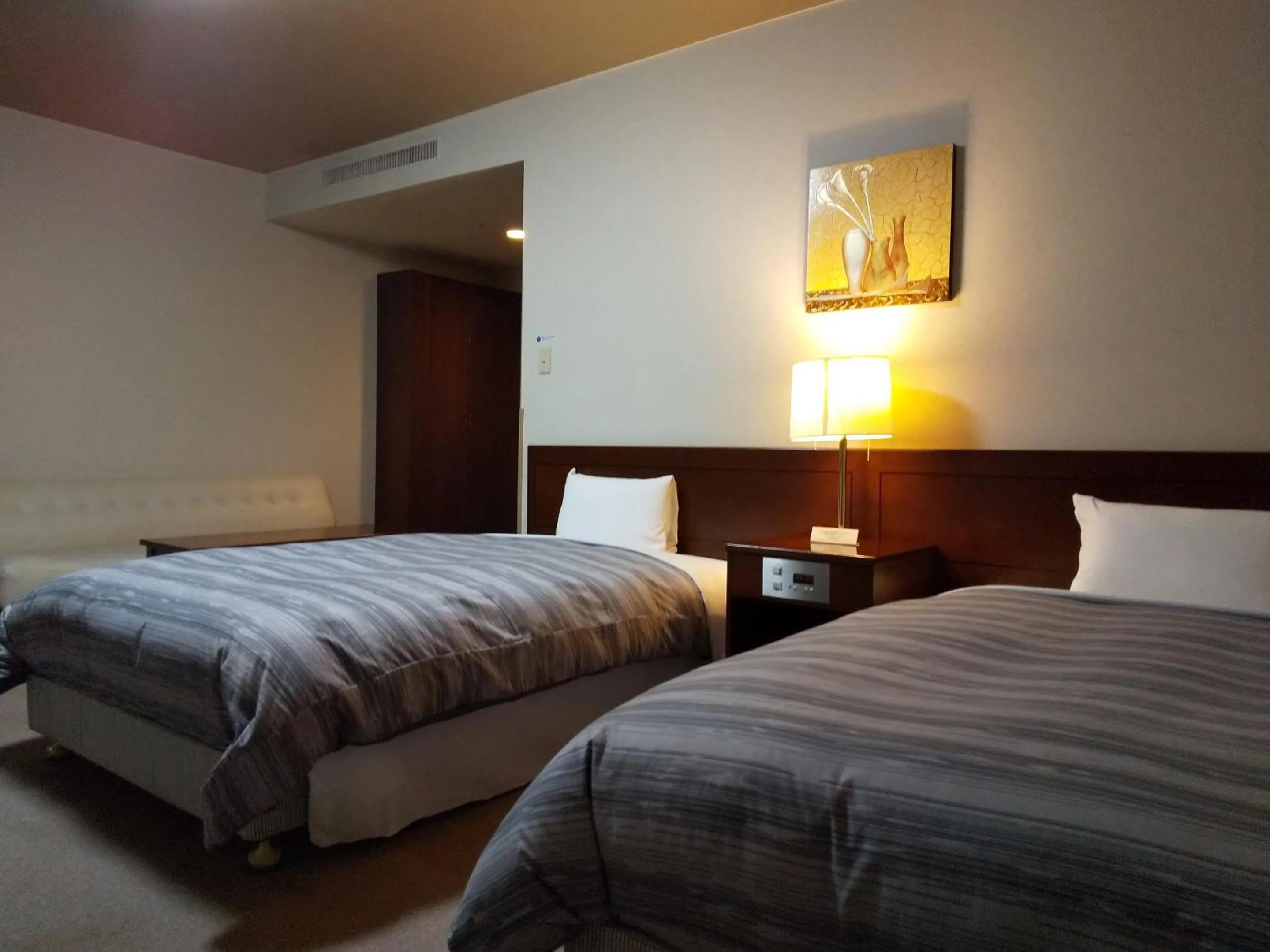 Bed in Route Inn Grantia Akita Spa Resort