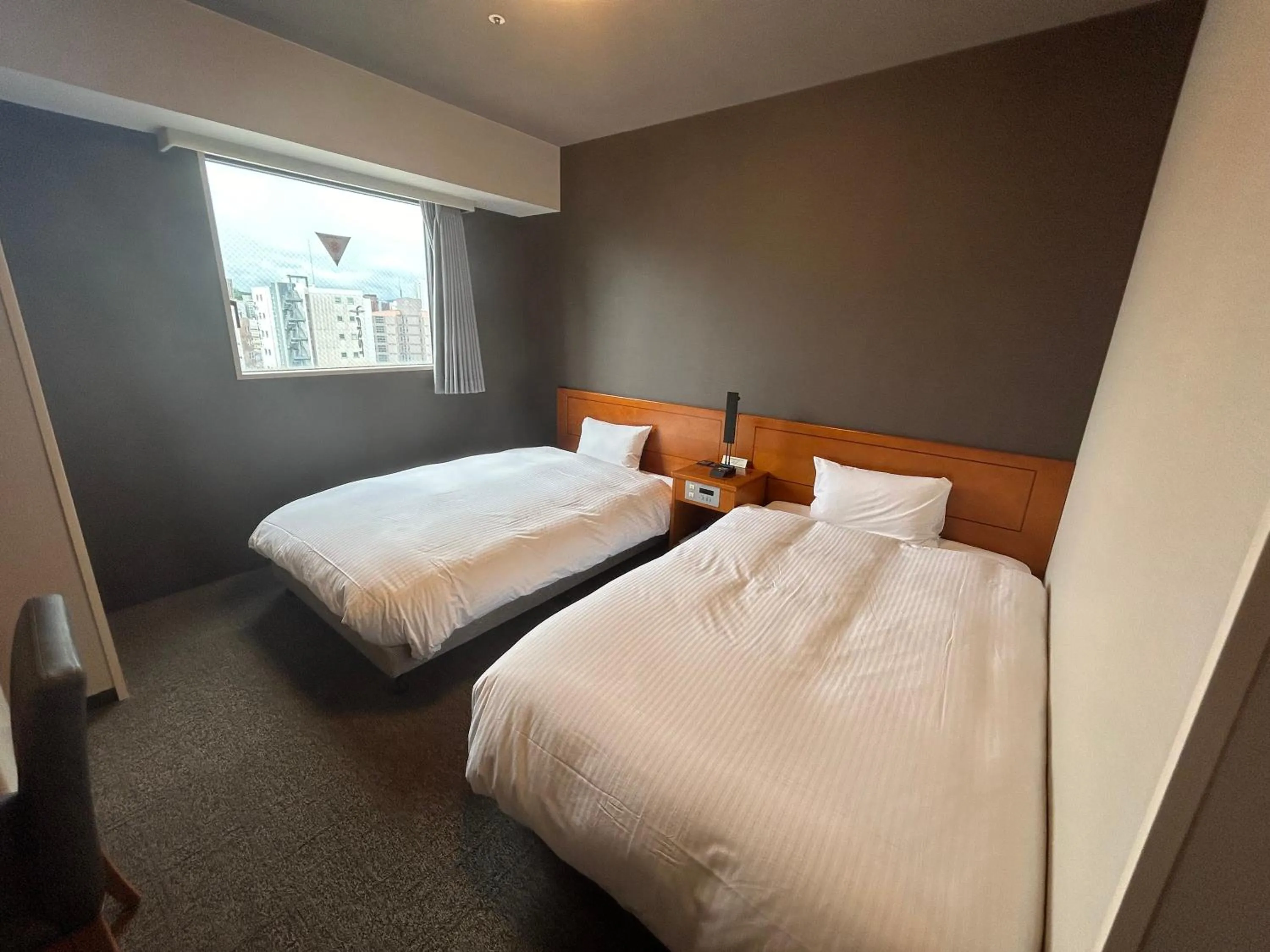 Photo of the whole room, Bed in Hotel Route-Inn Kanazawa Ekimae