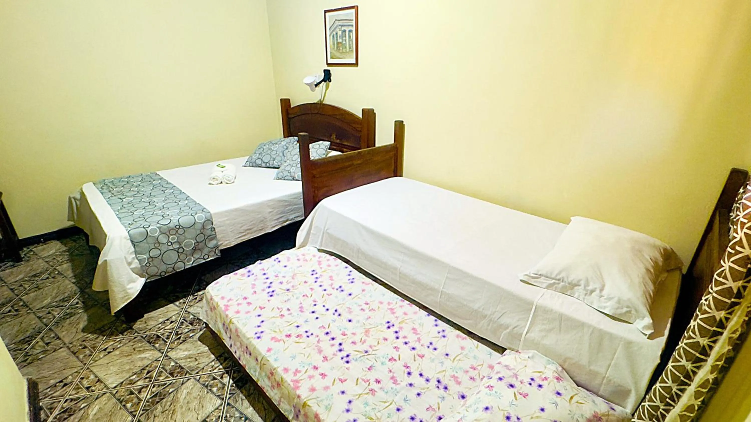 Bed in Pousada Parque Imperial no centro de Paraty