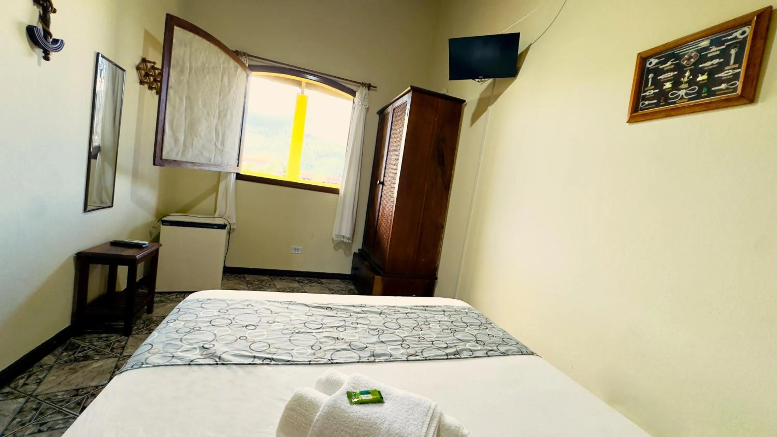 Bed in Pousada Parque Imperial no centro de Paraty