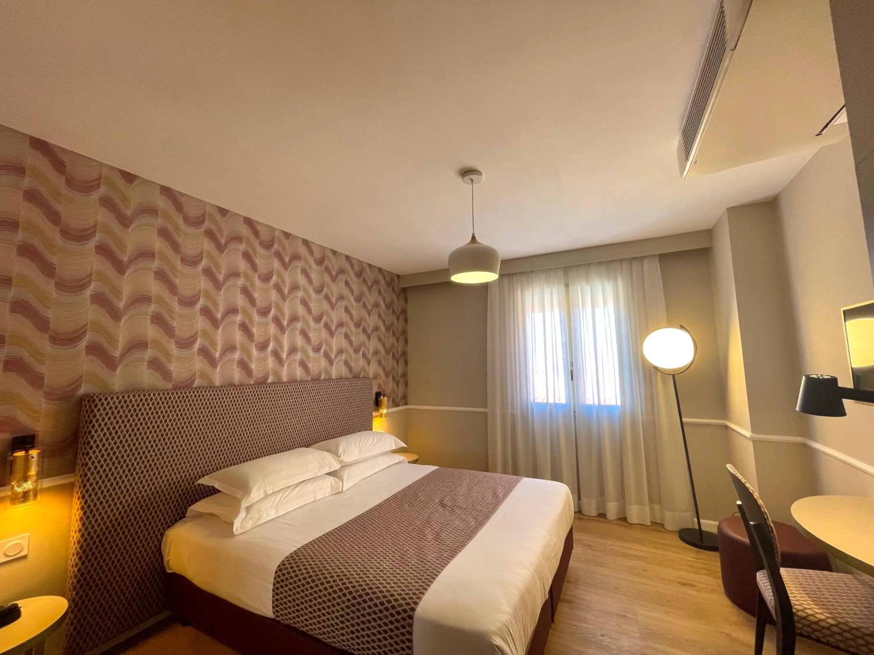 Bed in Hotel Restaurant Christophe Colomb