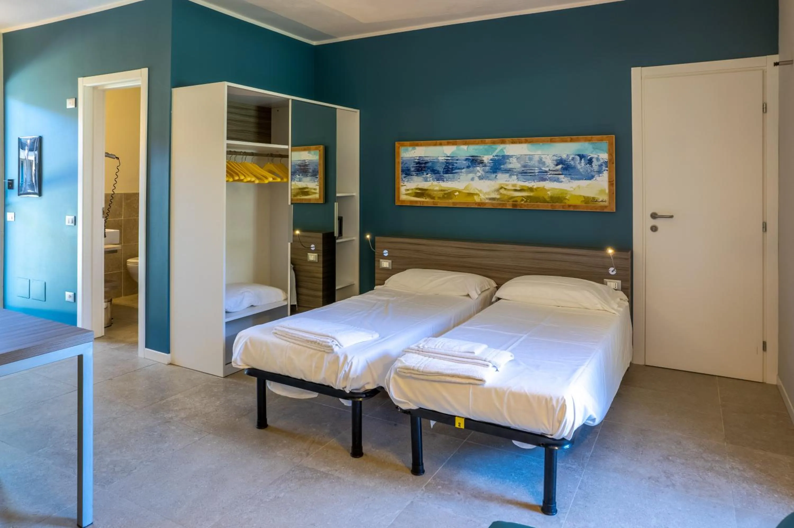 Bed in Golfo del Sole Hotel & Holiday Resort