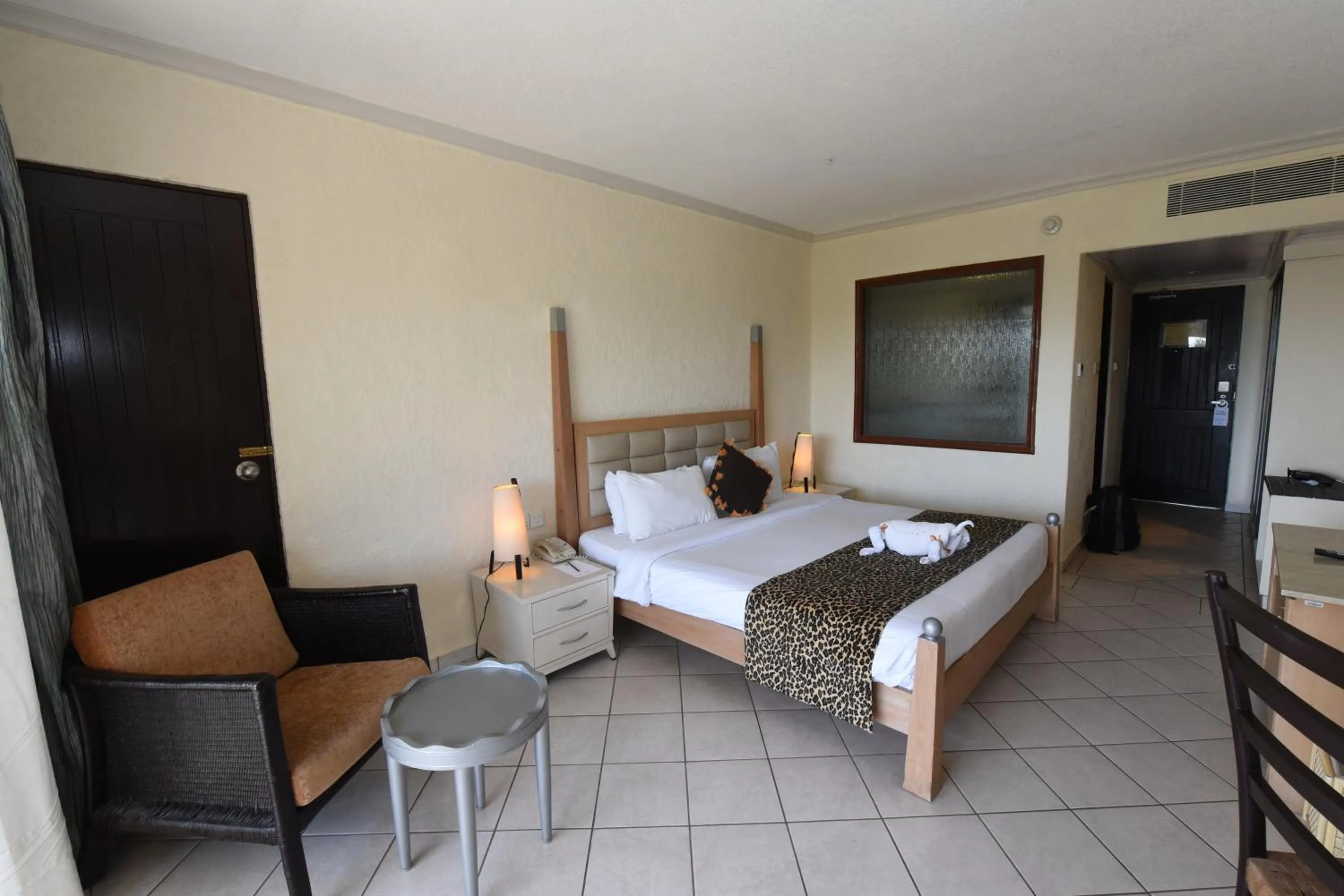 Bedroom, Bed in Diani Reef Beach Resort & Spa - Your Beachfront Bliss Awaits