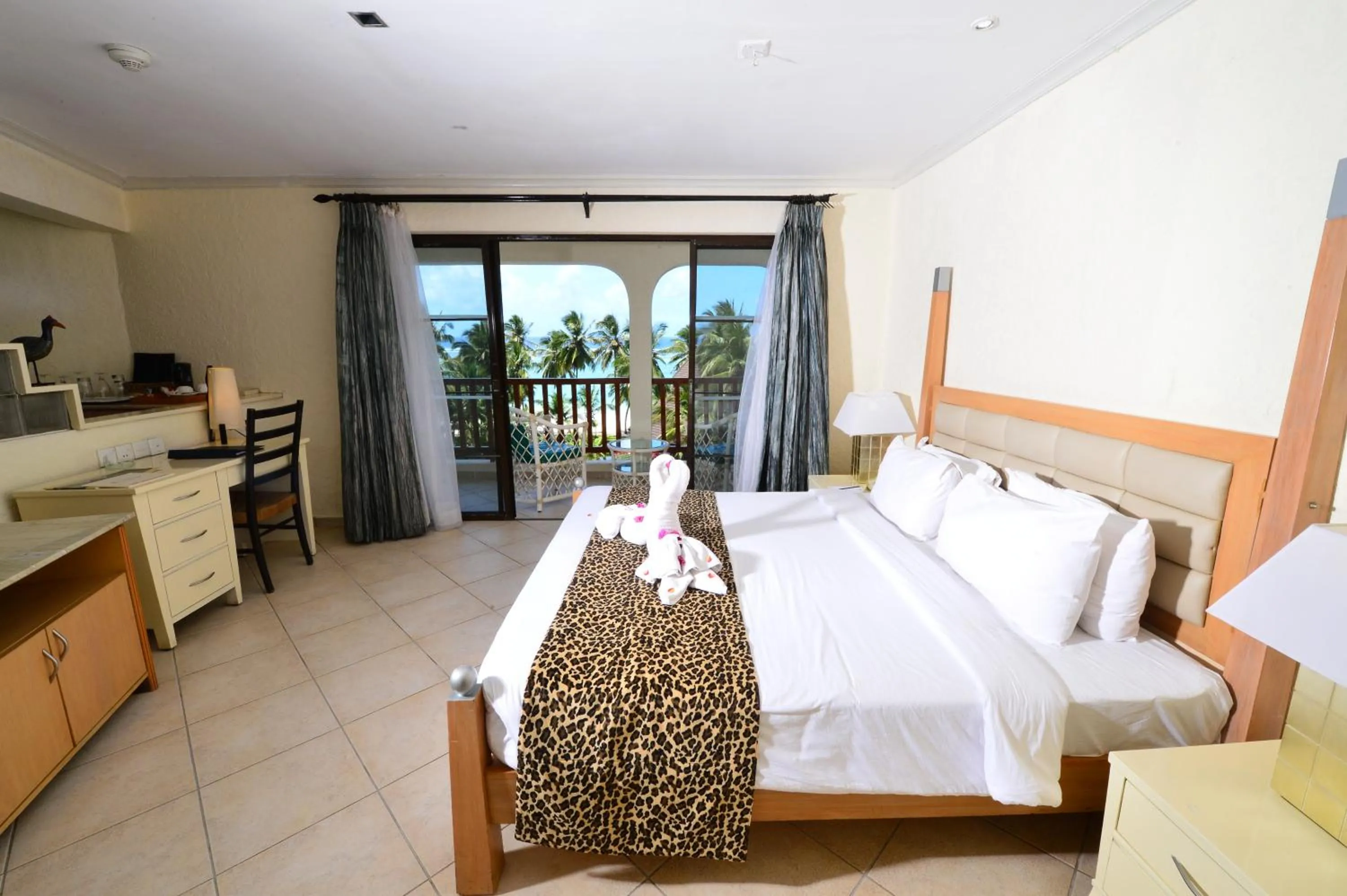 Bedroom, Bed in Diani Reef Beach Resort & Spa - Your Beachfront Bliss Awaits