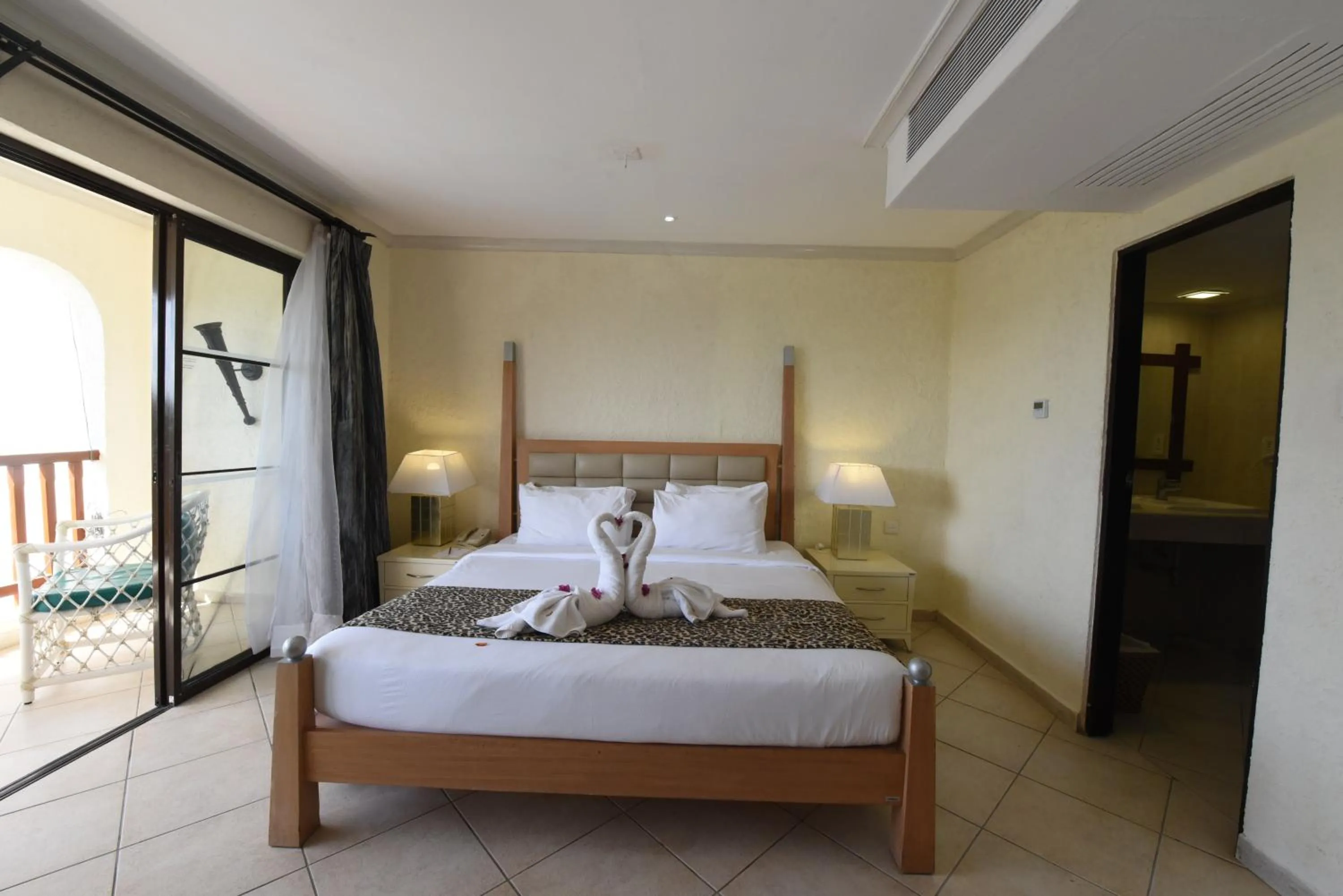 Bedroom, Bed in Diani Reef Beach Resort & Spa - Your Beachfront Bliss Awaits