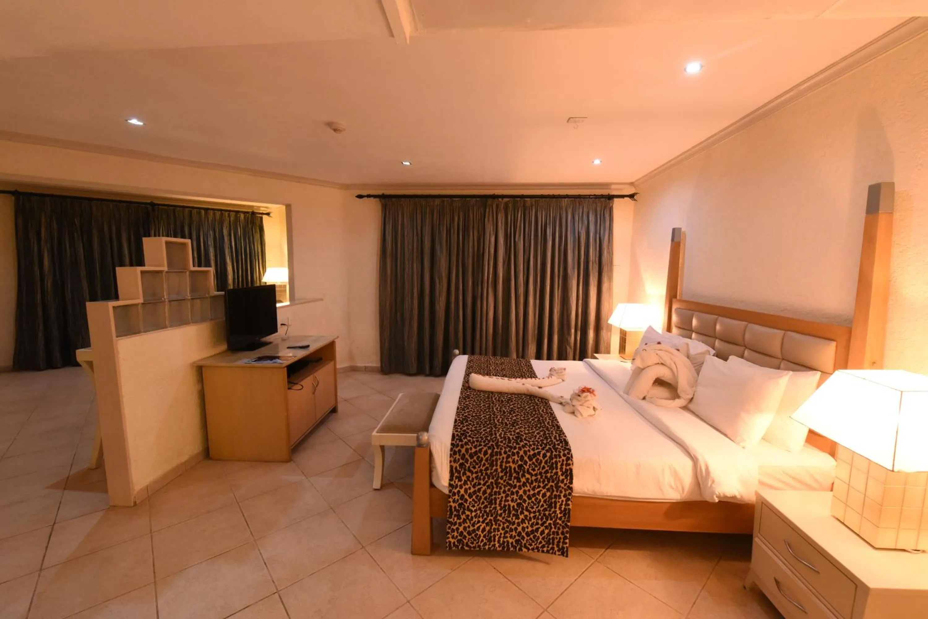 Bedroom, Bed in Diani Reef Beach Resort & Spa - Your Beachfront Bliss Awaits
