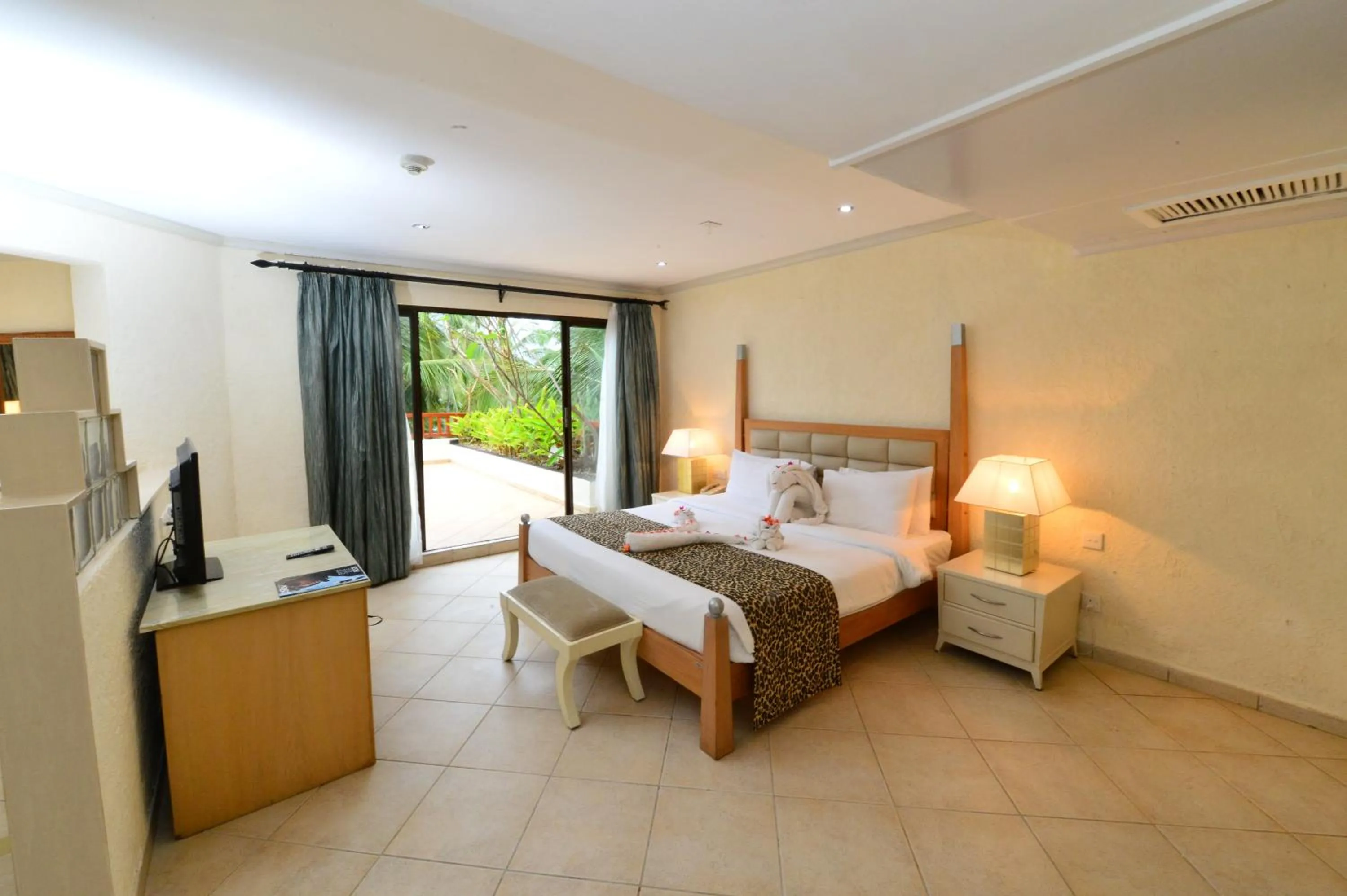 Bedroom, Bed in Diani Reef Beach Resort & Spa - Your Beachfront Bliss Awaits