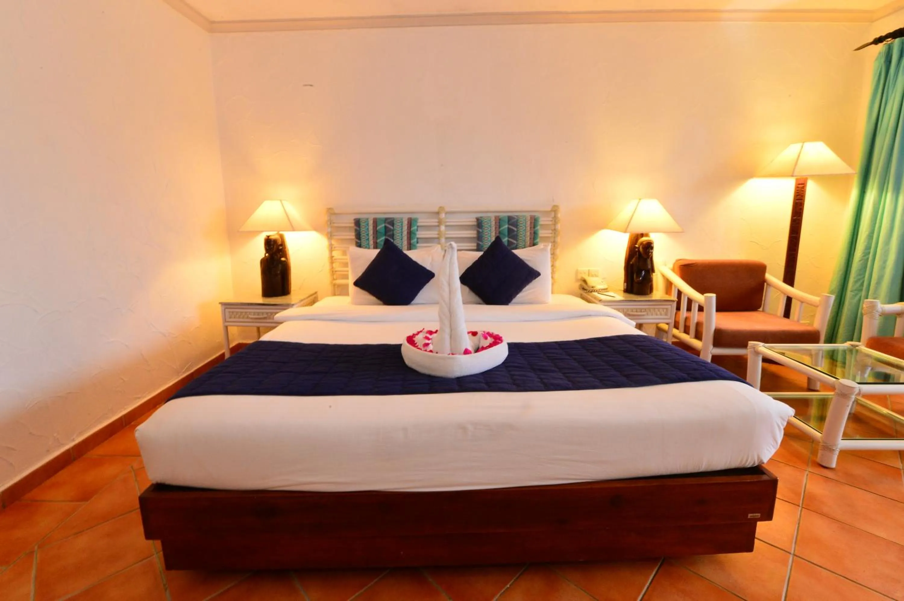 Bedroom, Bed in Diani Reef Beach Resort & Spa - Your Beachfront Bliss Awaits