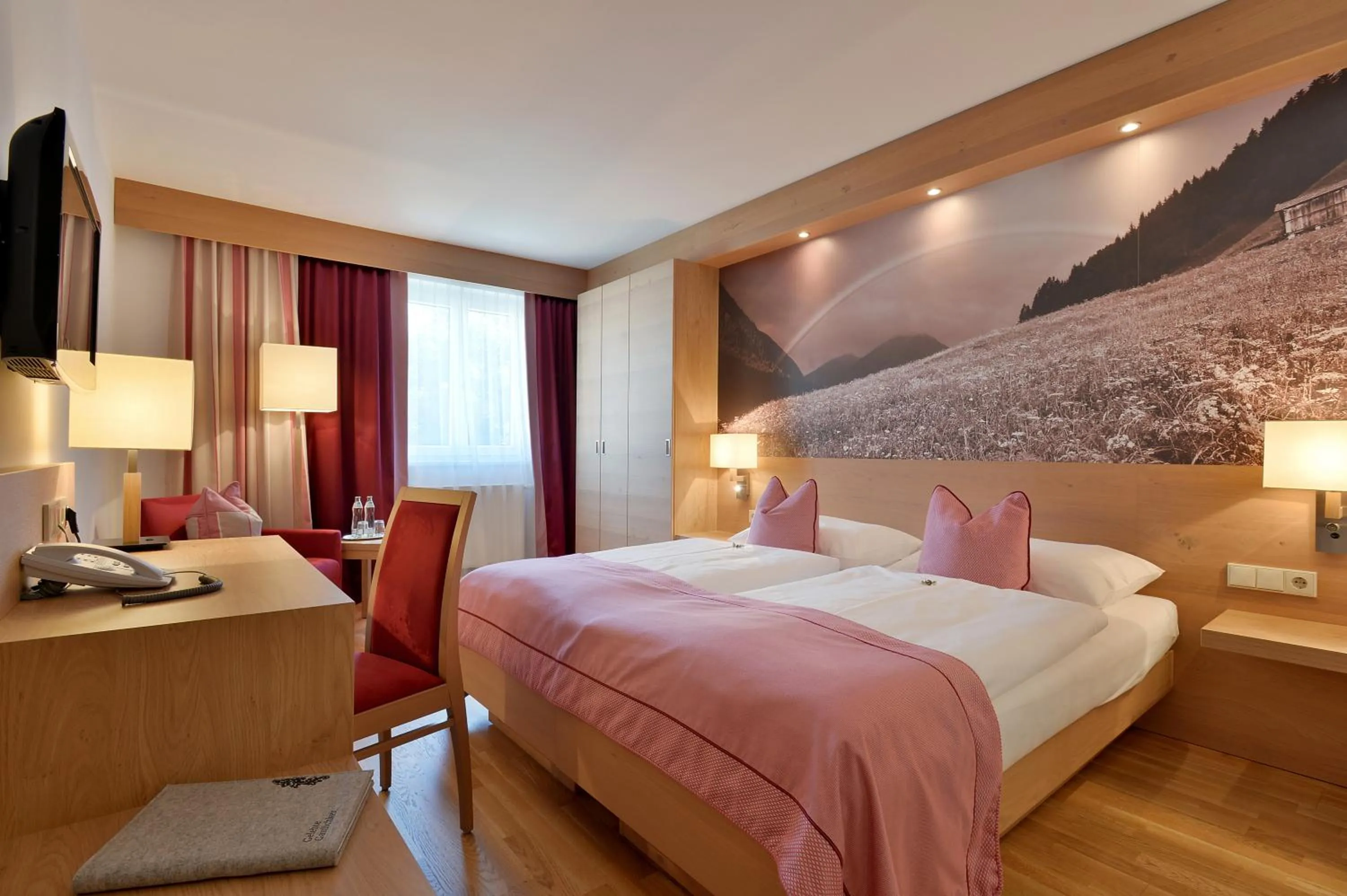Photo of the whole room, Bed in Hotel Goldener Adler Wattens