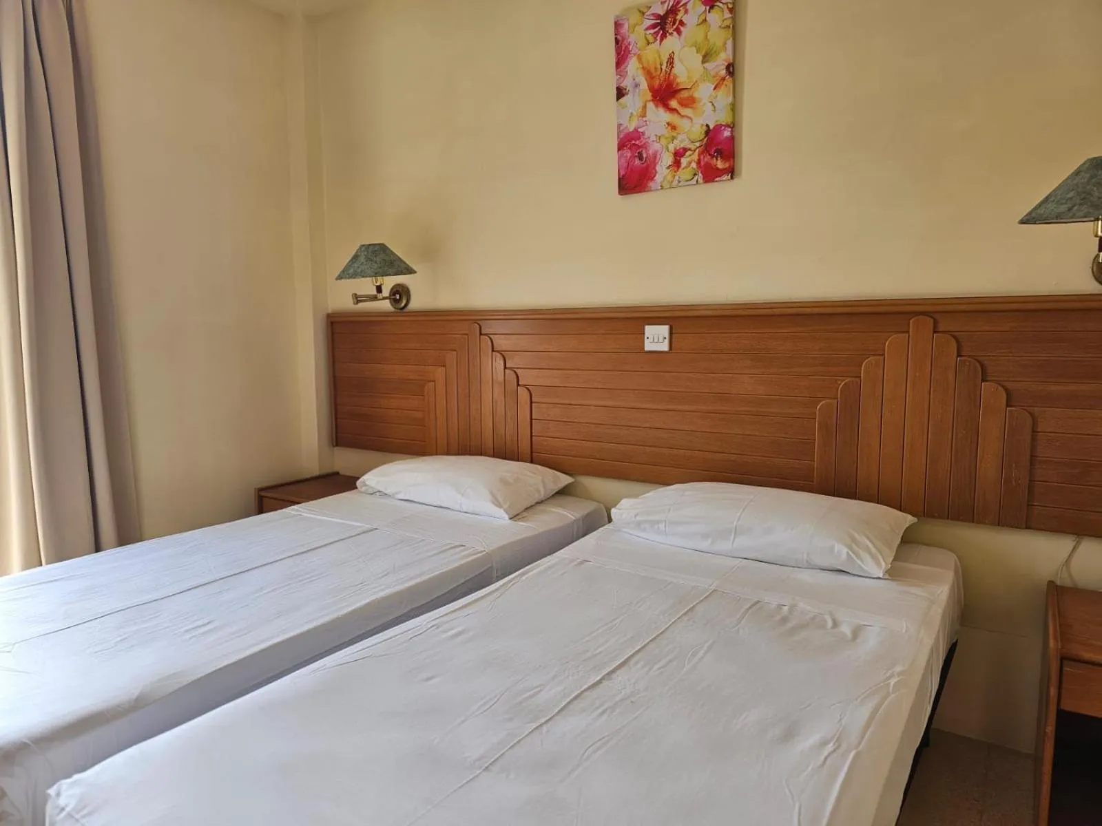 Bed in Ambassador Hotel