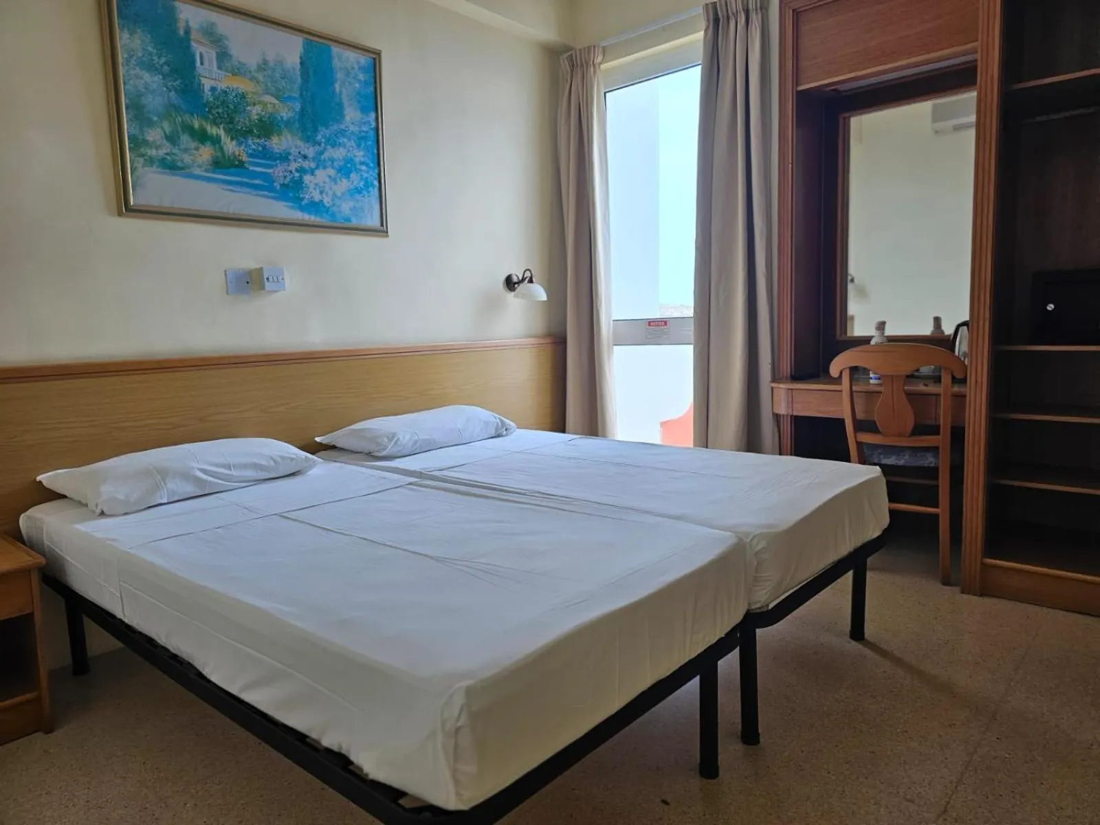 Bed in Ambassador Hotel