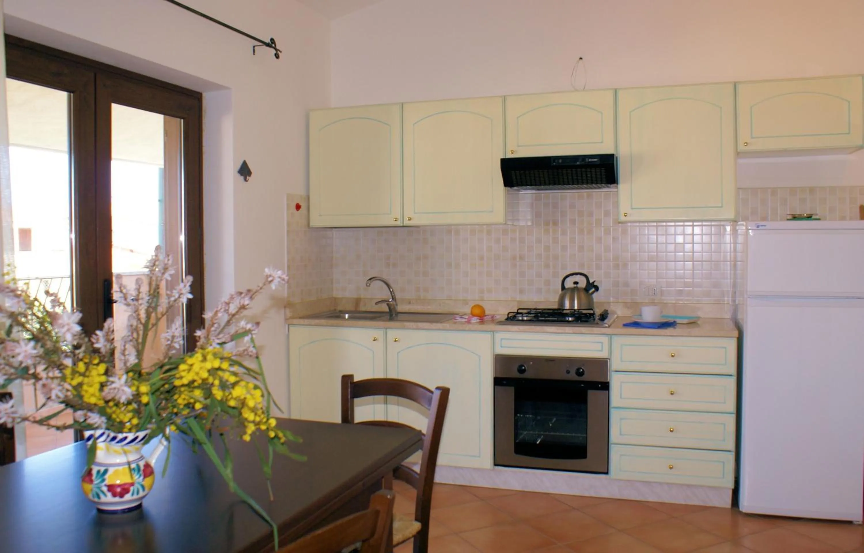 Kitchen or kitchenette in Sa Fiorida Appartamenti