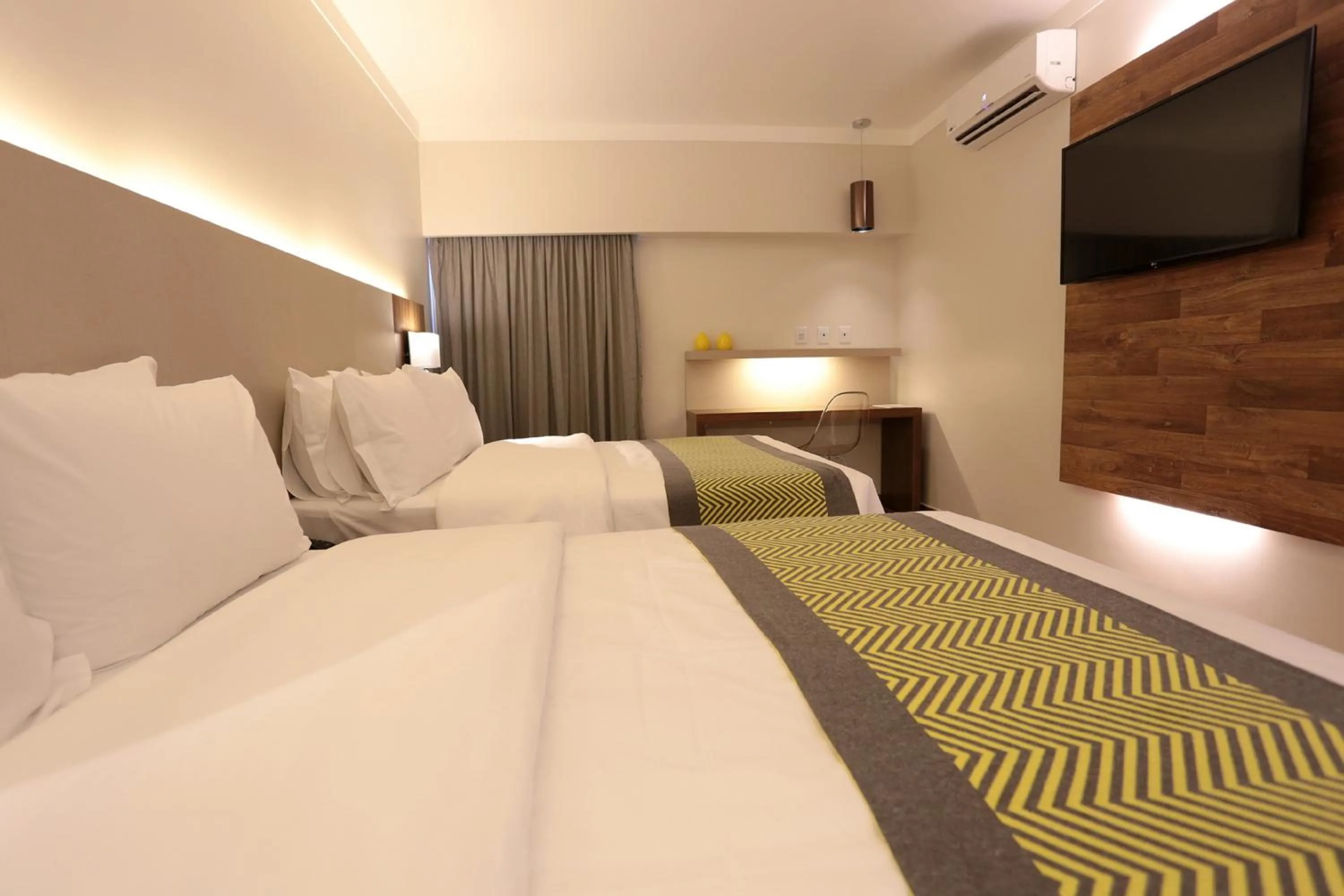 Bed in Oasis Plaza Hotel