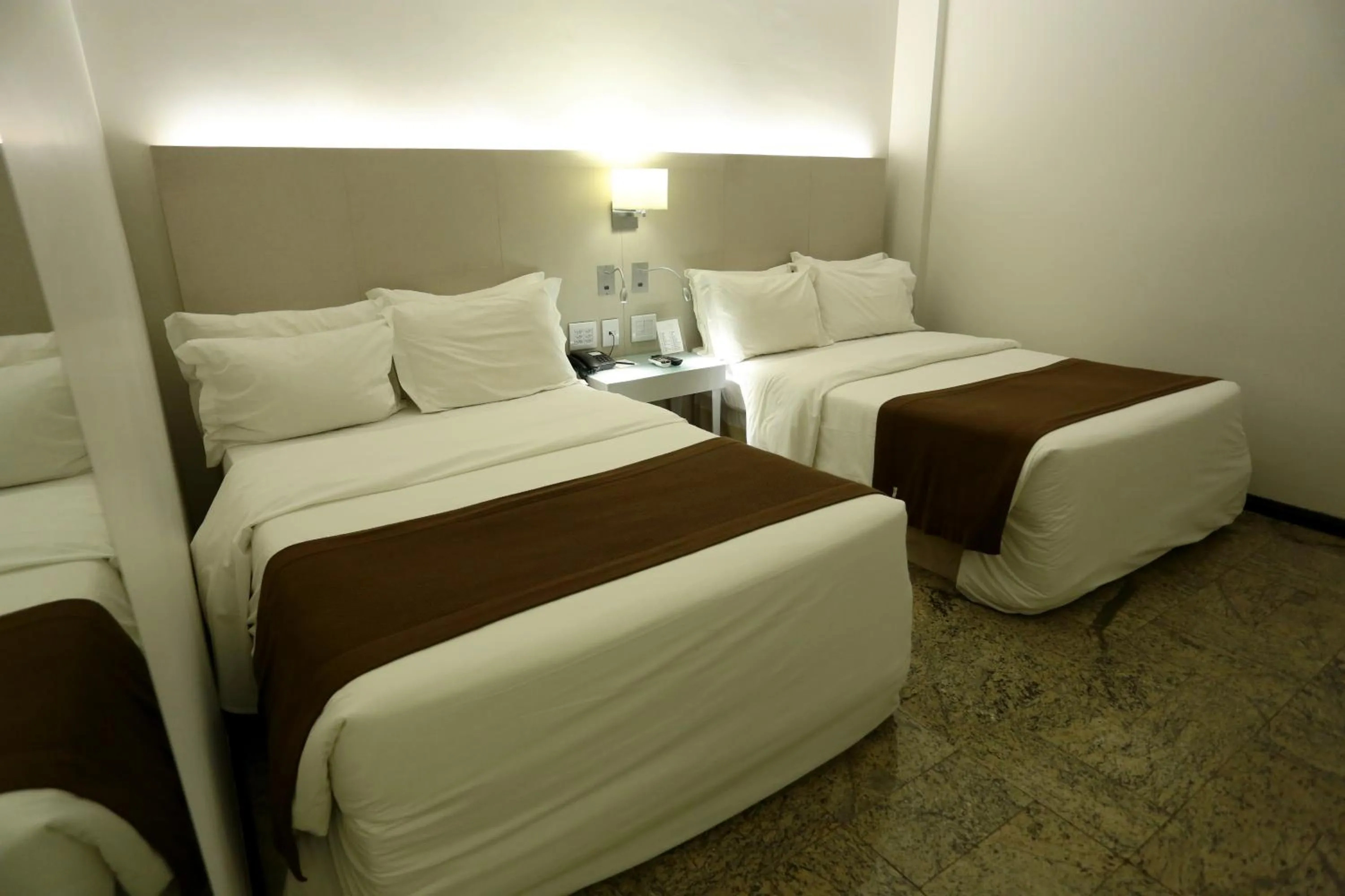 Bed in Oasis Plaza Hotel