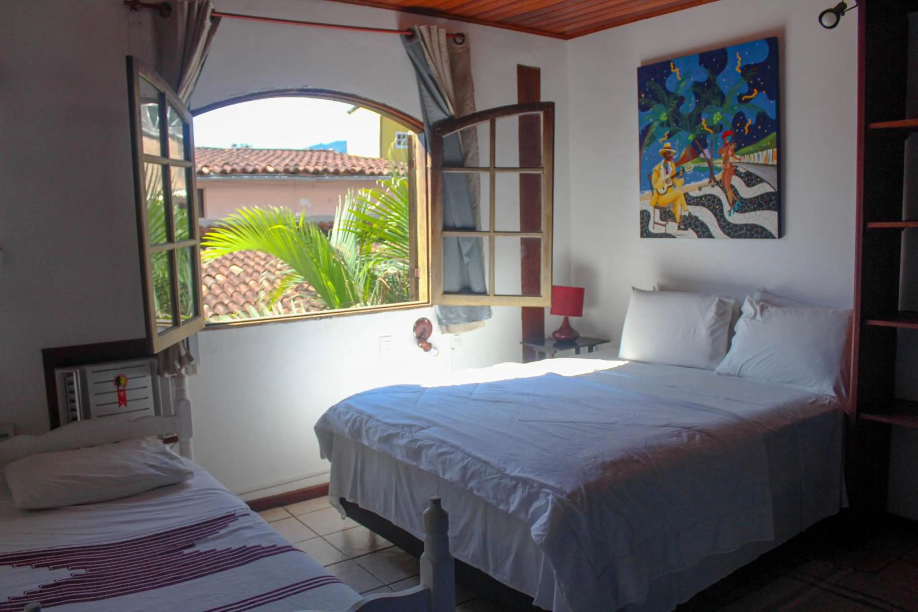 Bed in Pousada Tropicana