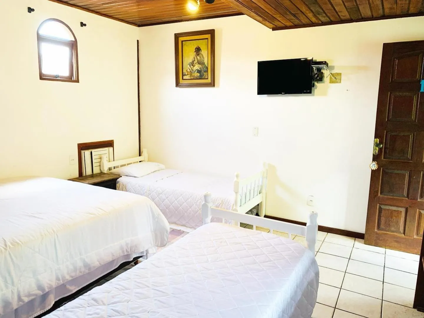 Bed in Pousada Tropicana