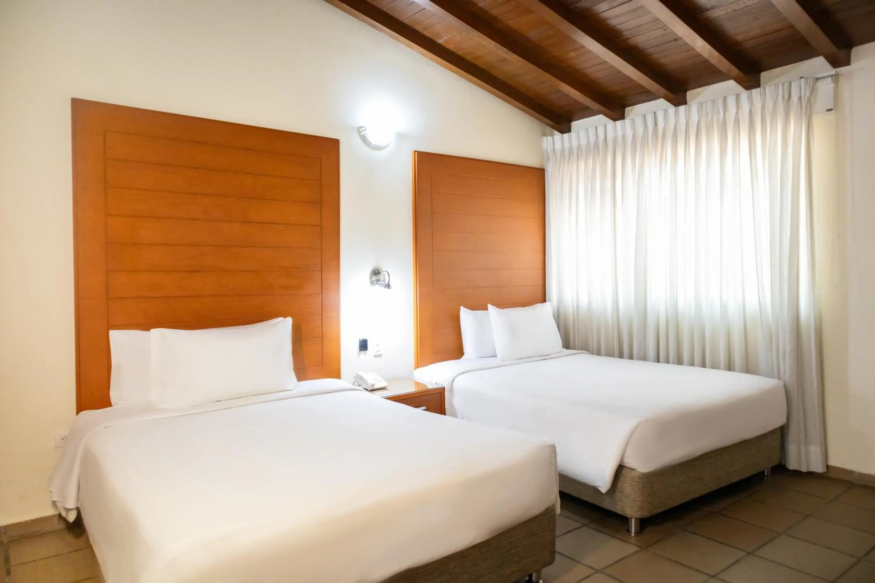 Bed in Hotel Faranda Bolivar Cucuta, a member of Radisson Individuals