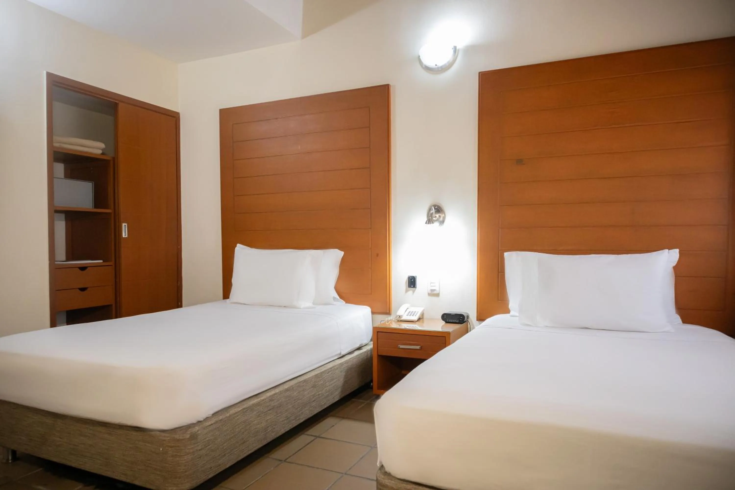 Bed in Hotel Faranda Bolivar Cucuta, a member of Radisson Individuals