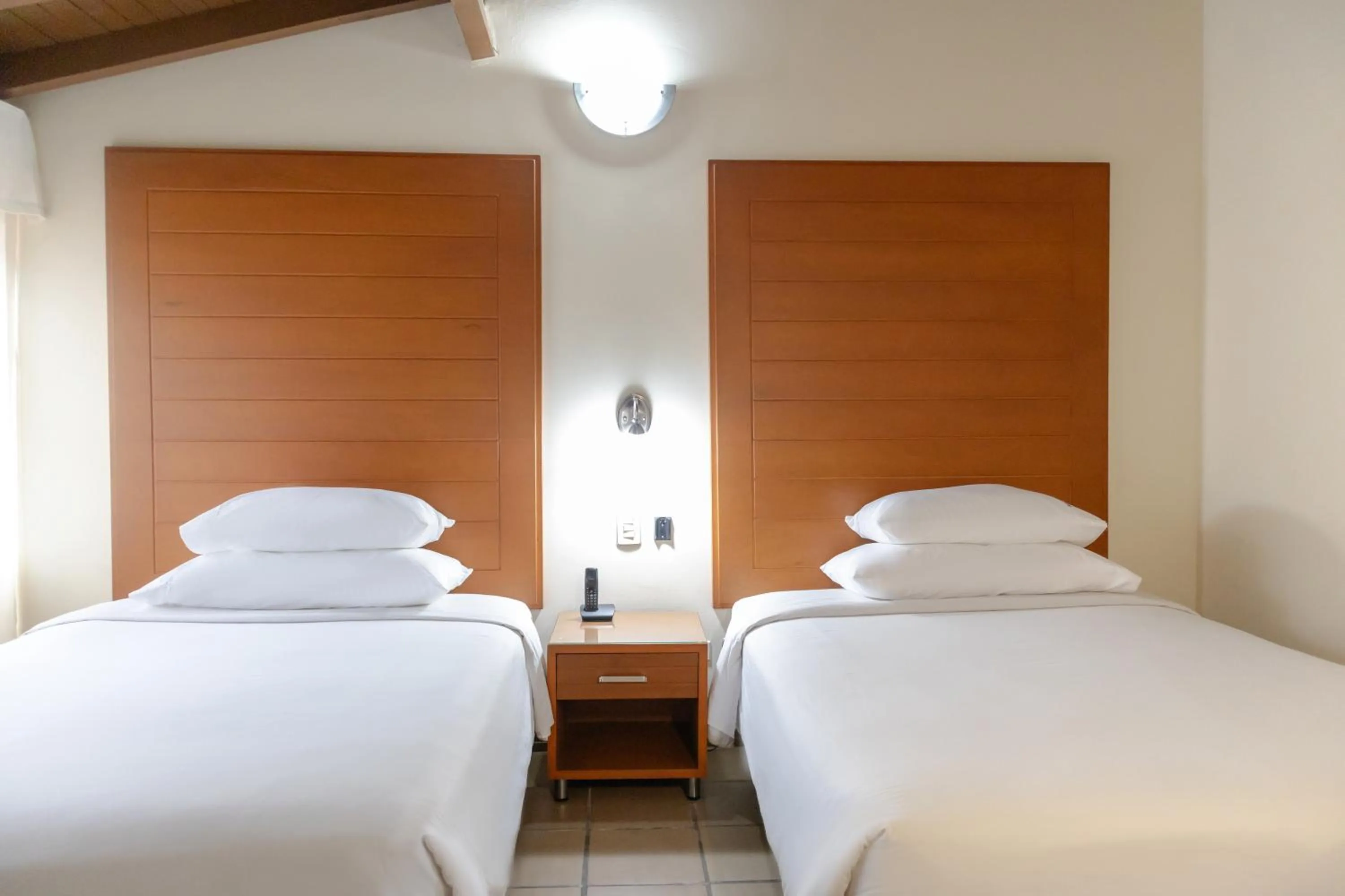 Bed in Hotel Faranda Bolivar Cucuta, a member of Radisson Individuals