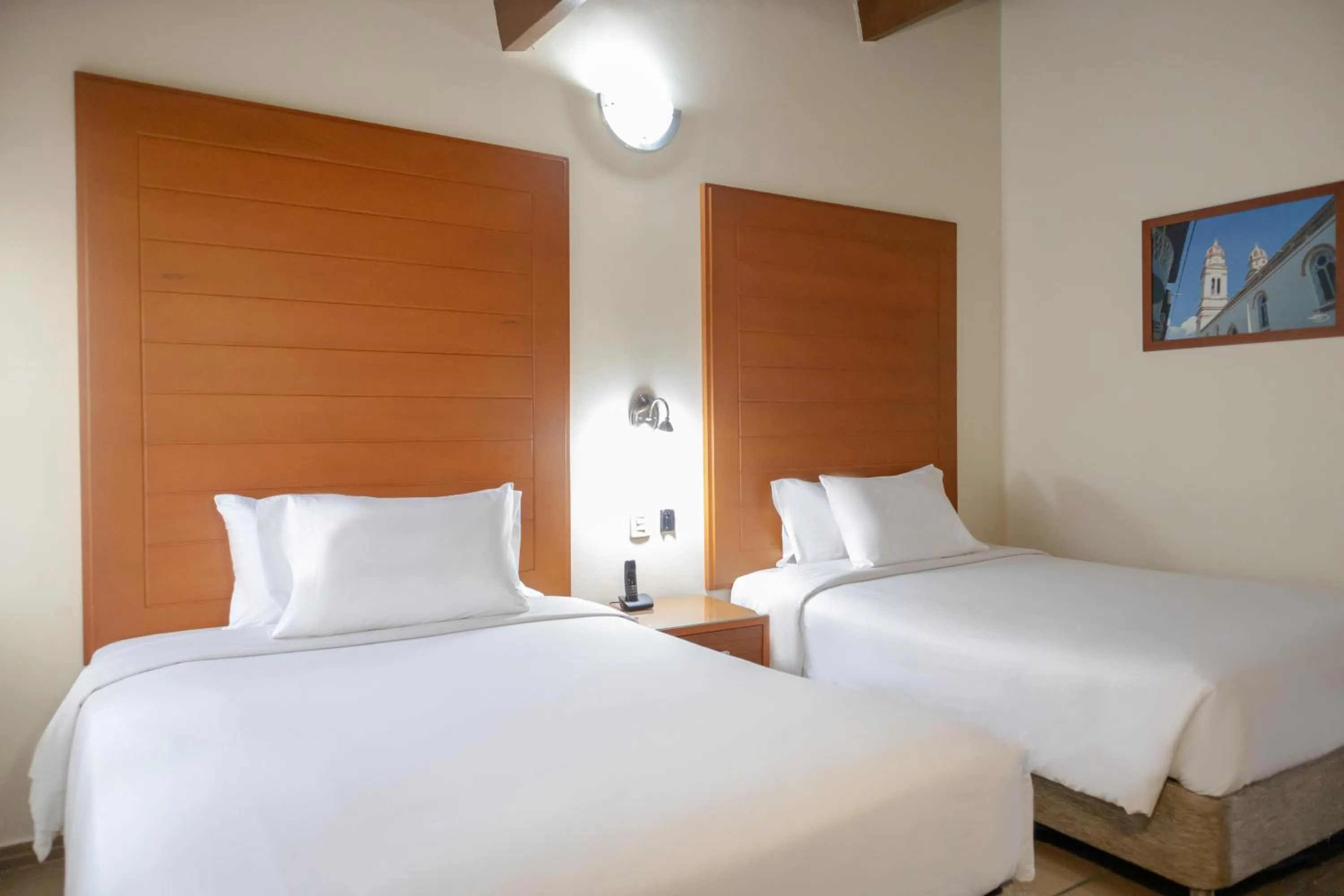 Bed in Hotel Faranda Bolivar Cucuta, a member of Radisson Individuals