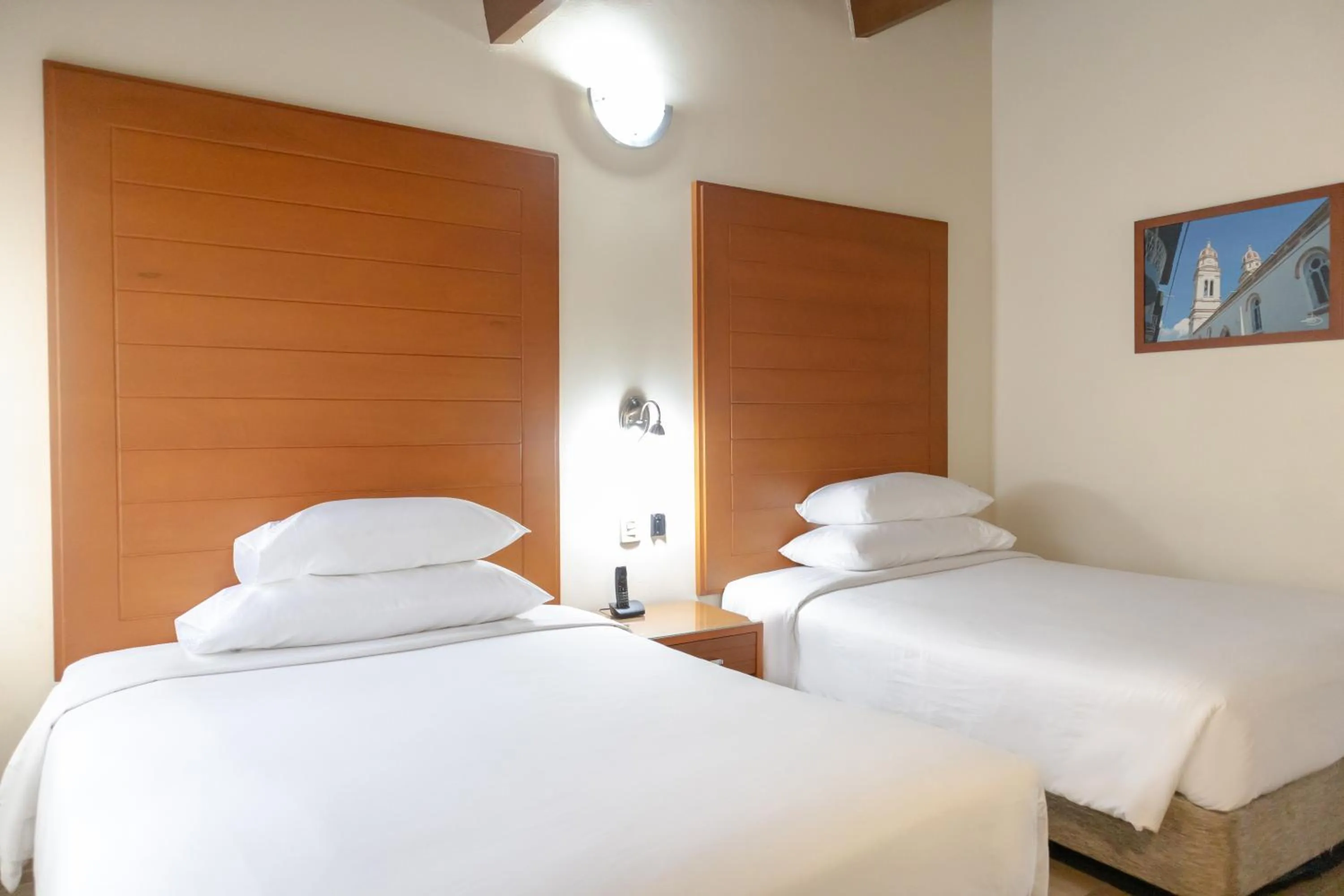 Bed in Hotel Faranda Bolivar Cucuta, a member of Radisson Individuals