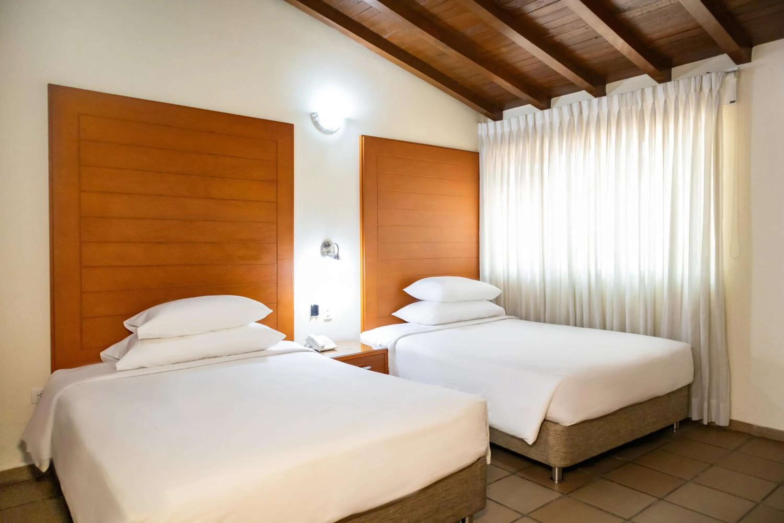 Bed in Hotel Faranda Bolivar Cucuta, a member of Radisson Individuals