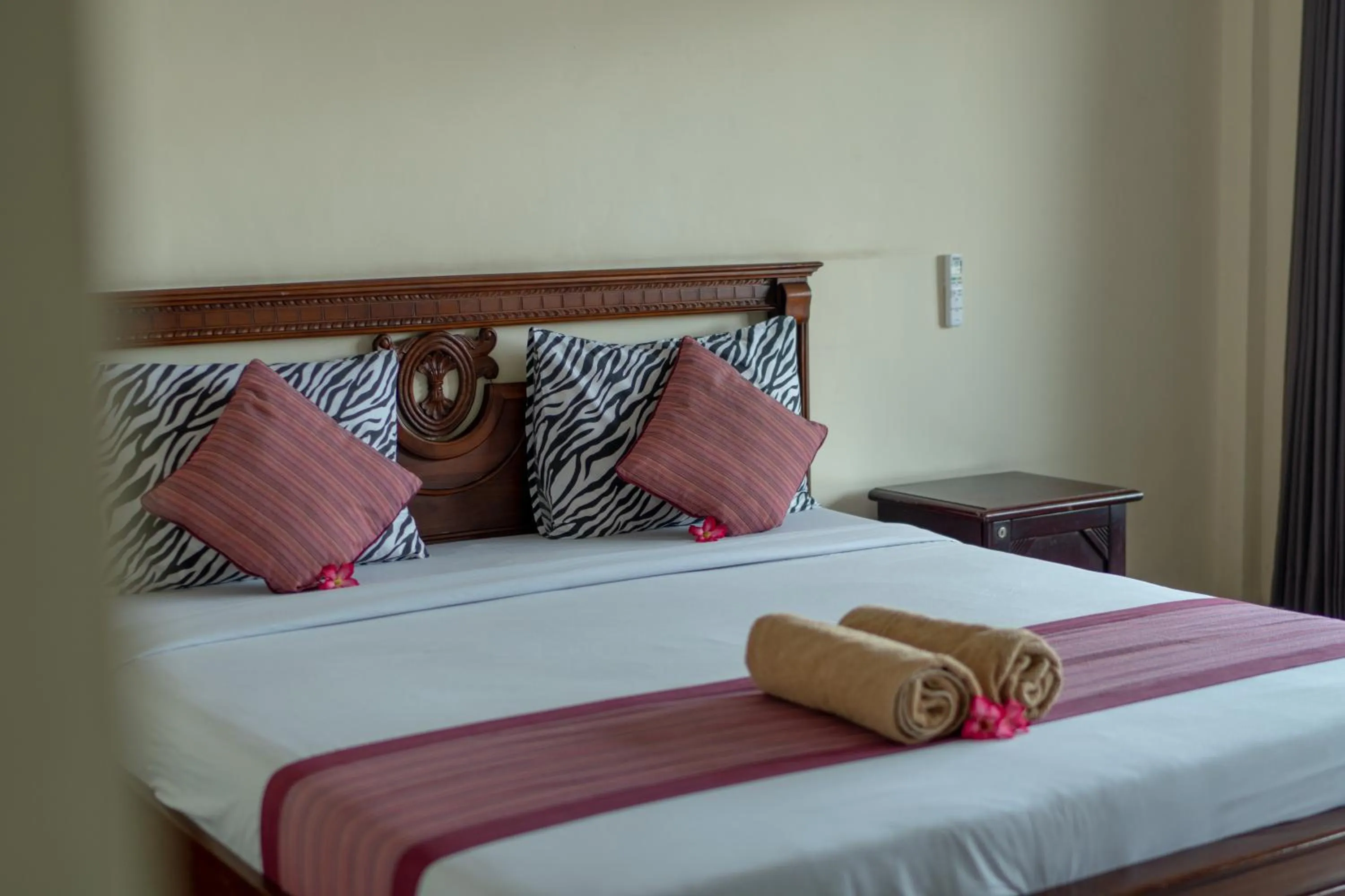 Bed in Warsa's Garden Bungalow and Spa