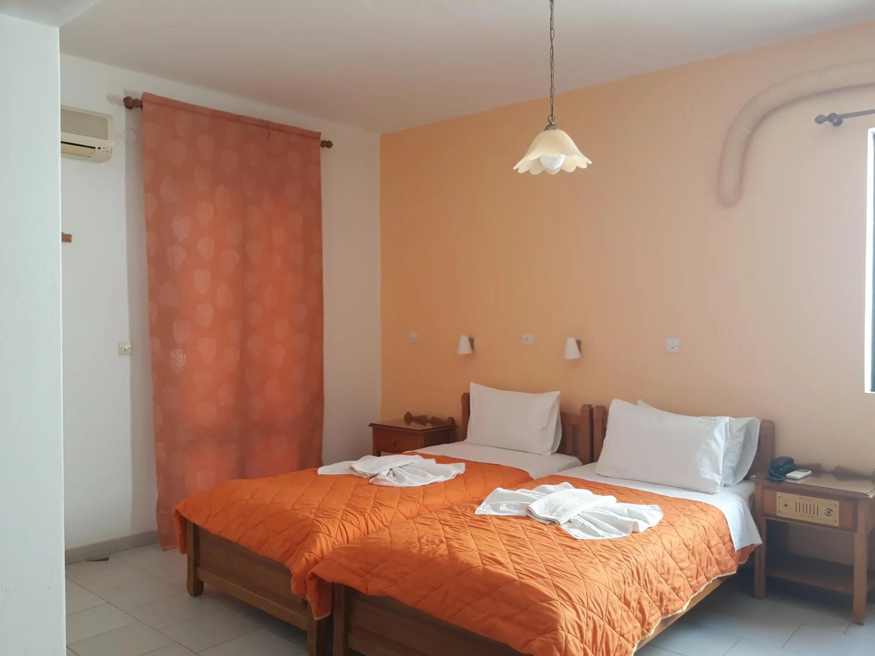 Bed in Amaryllis Hotel