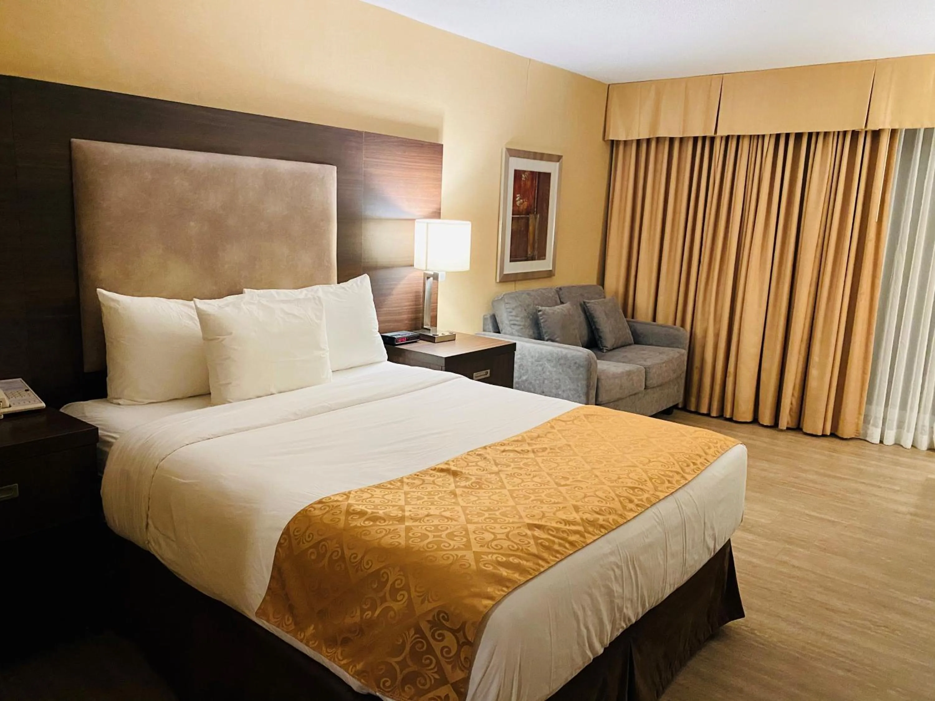 Bed in Ramada by Wyndham Belleville Harbourview Conference Center