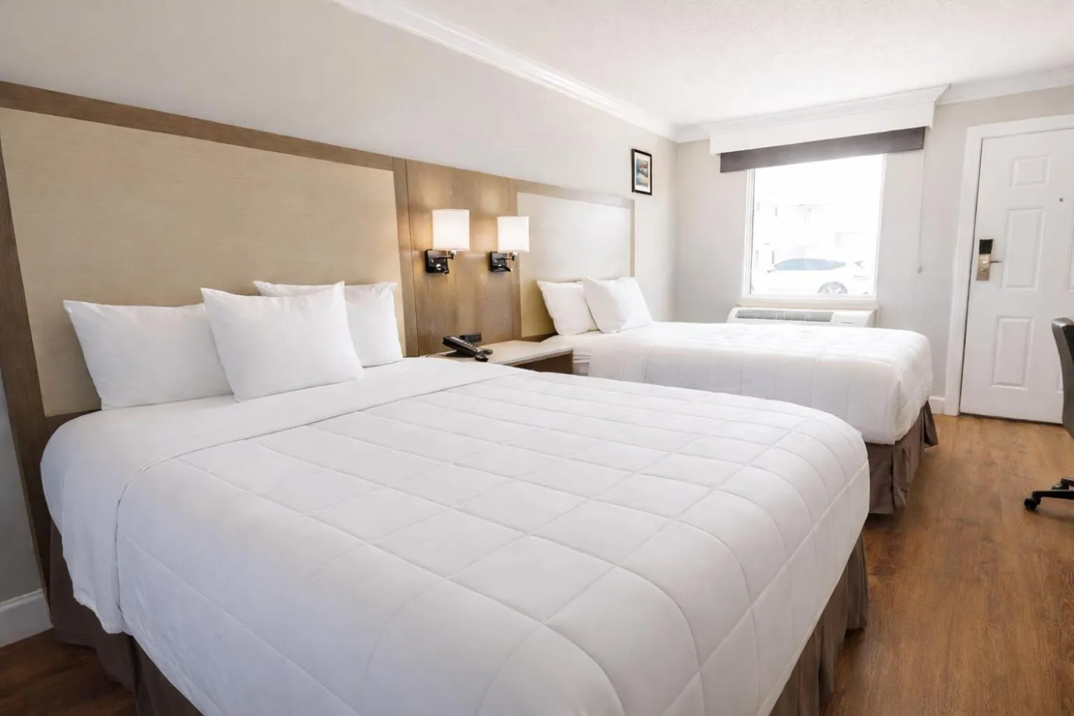 Bed in Destin Inn & Suites