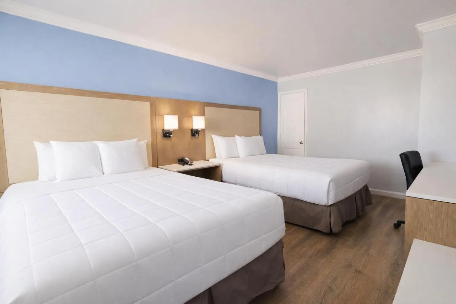 Bed in Destin Inn & Suites