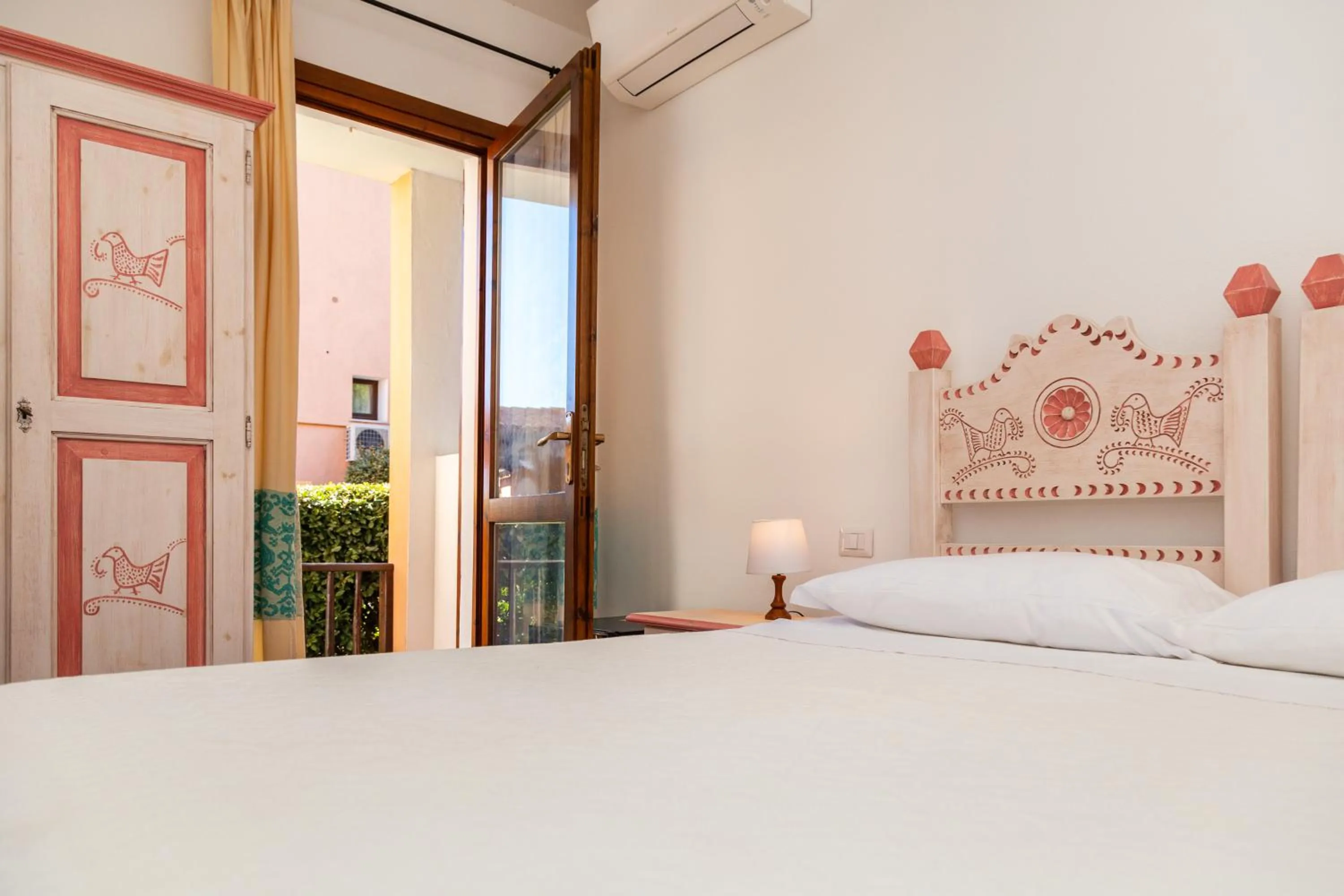 Bed in Hotel Piccolo Pevero