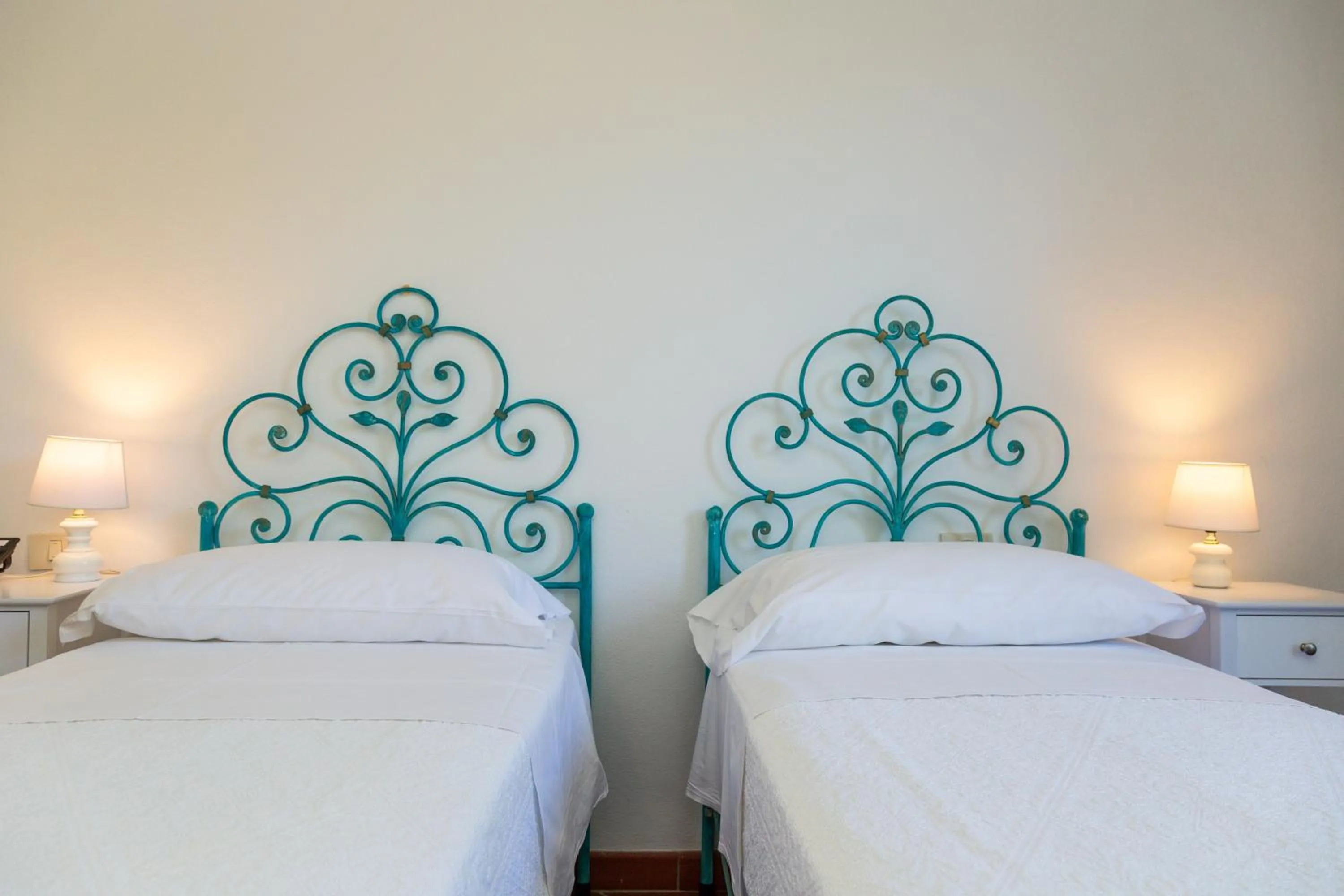 Bed in Hotel Piccolo Pevero