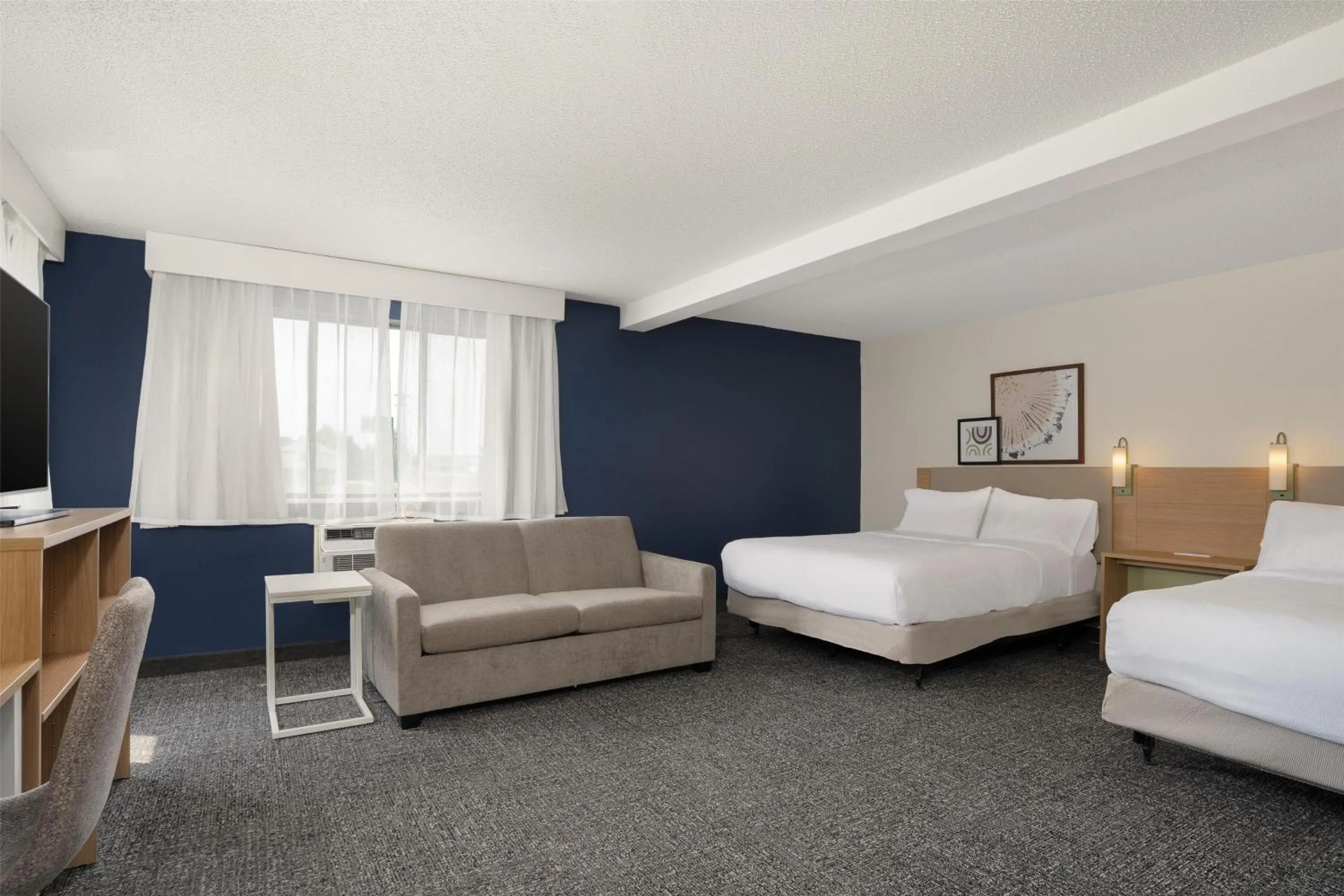 Living room, Bed in Spark by Hilton Carlisle South